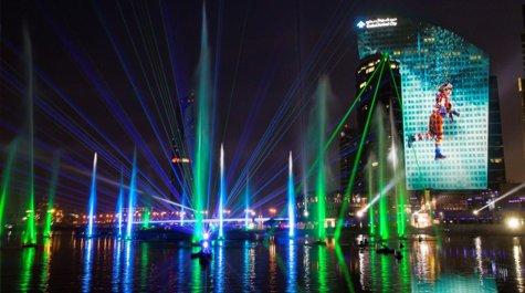 a large building with a large screen on top of it