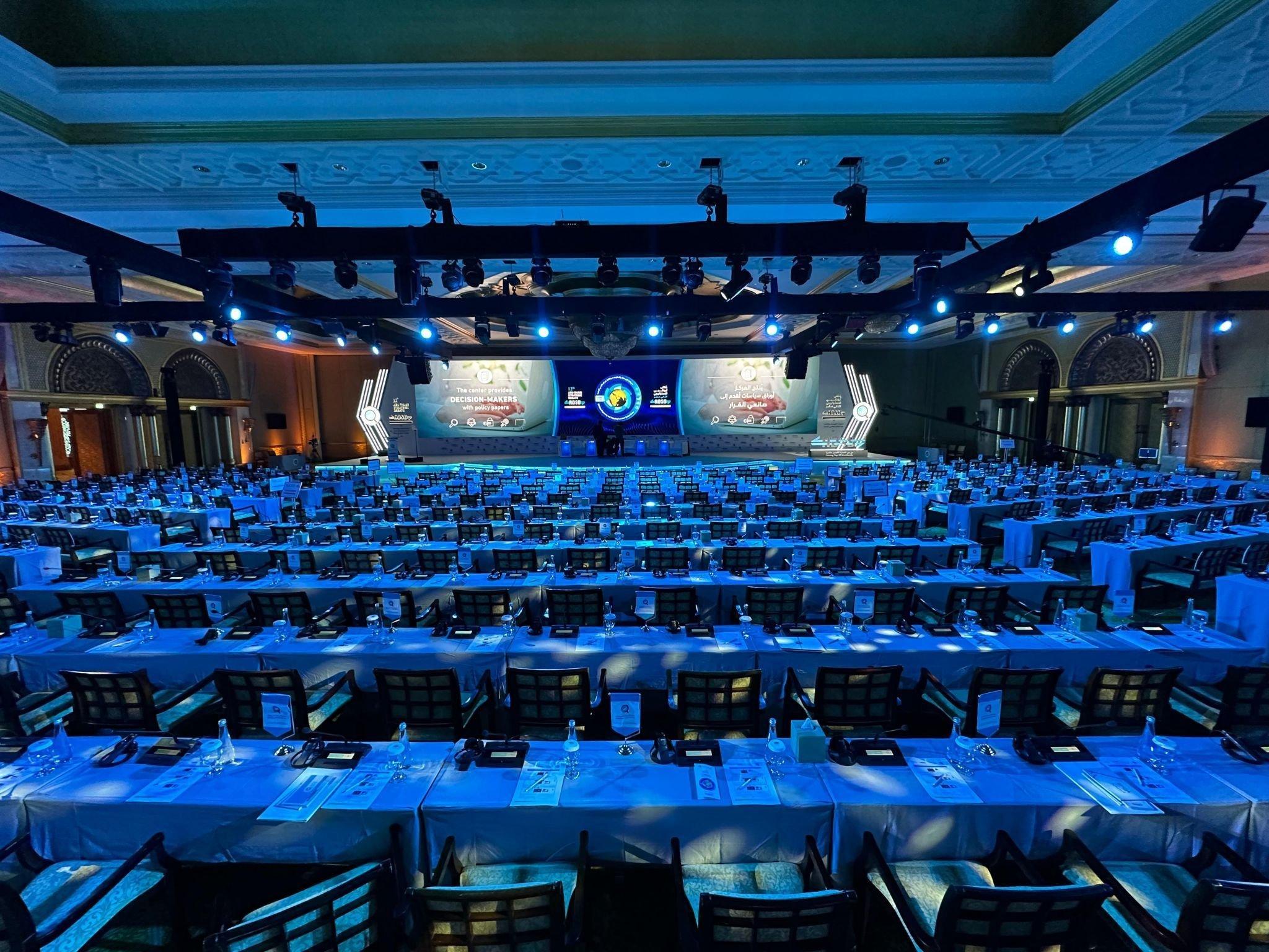 a large room with tables and chairs set up for a banquet