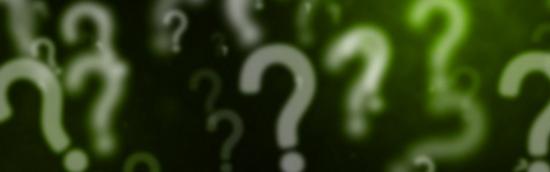 Question marks on a dark background