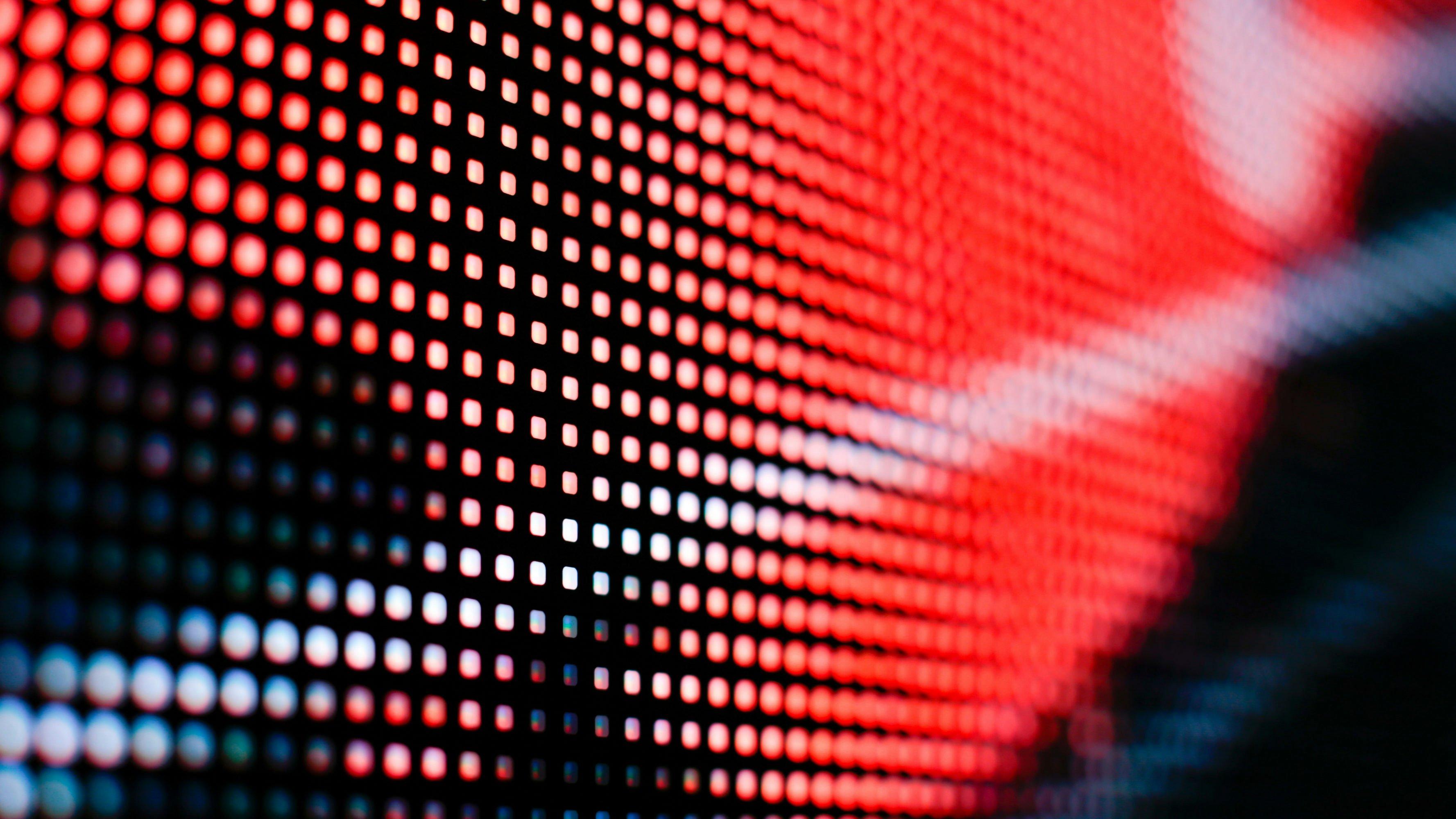 a close up of a red and black screen with a red and black pattern