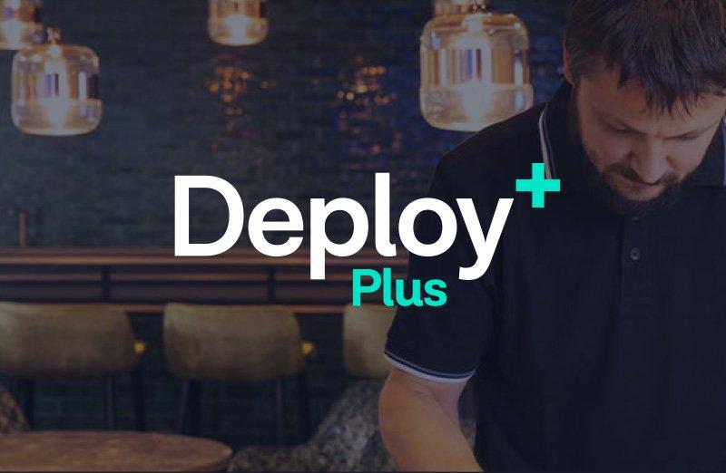 a man is standing in front of a table making a repair