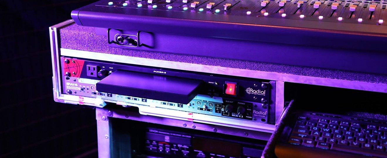 a close up of a keyboard and a mixer sitting on a table