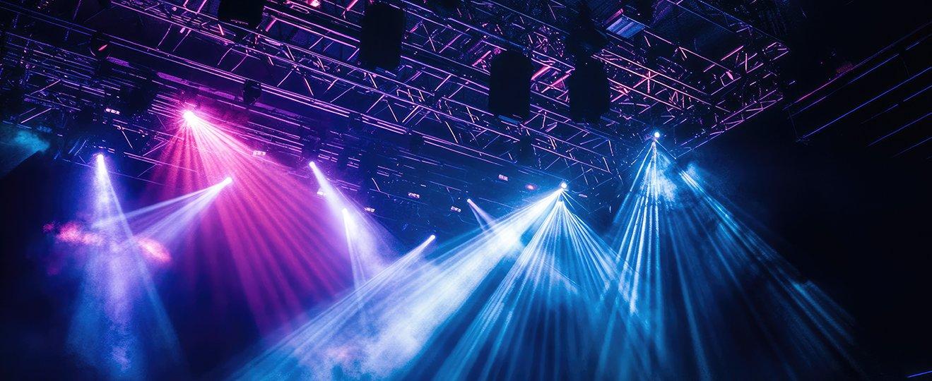 a group of colorful lights shining on a stage