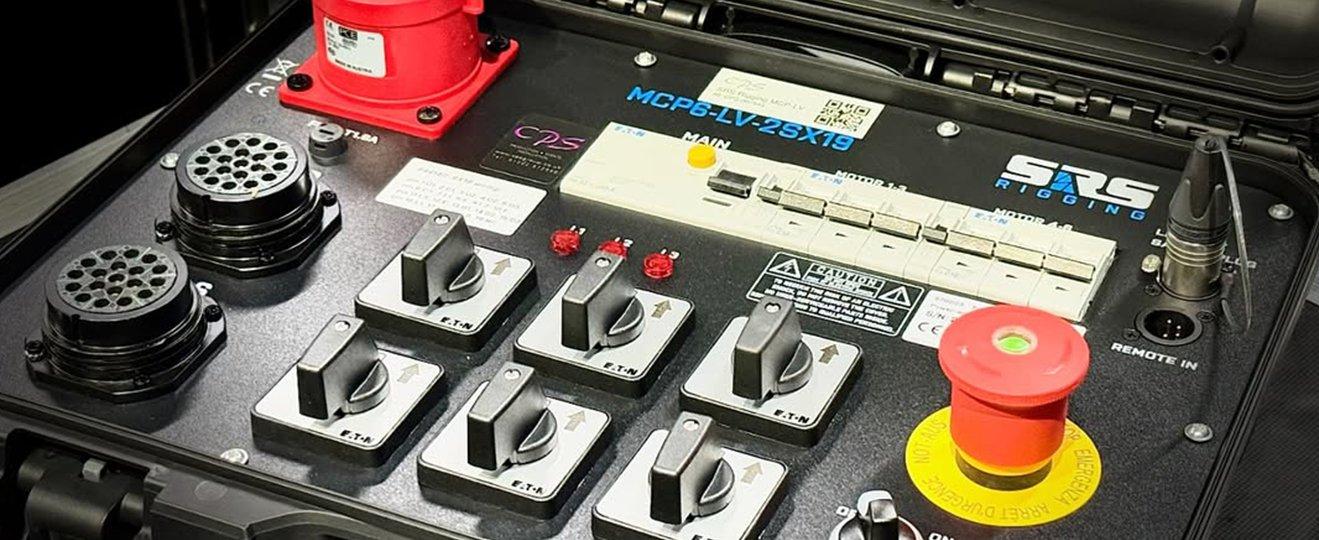 a close up of a control panel in a case with buttons and switches