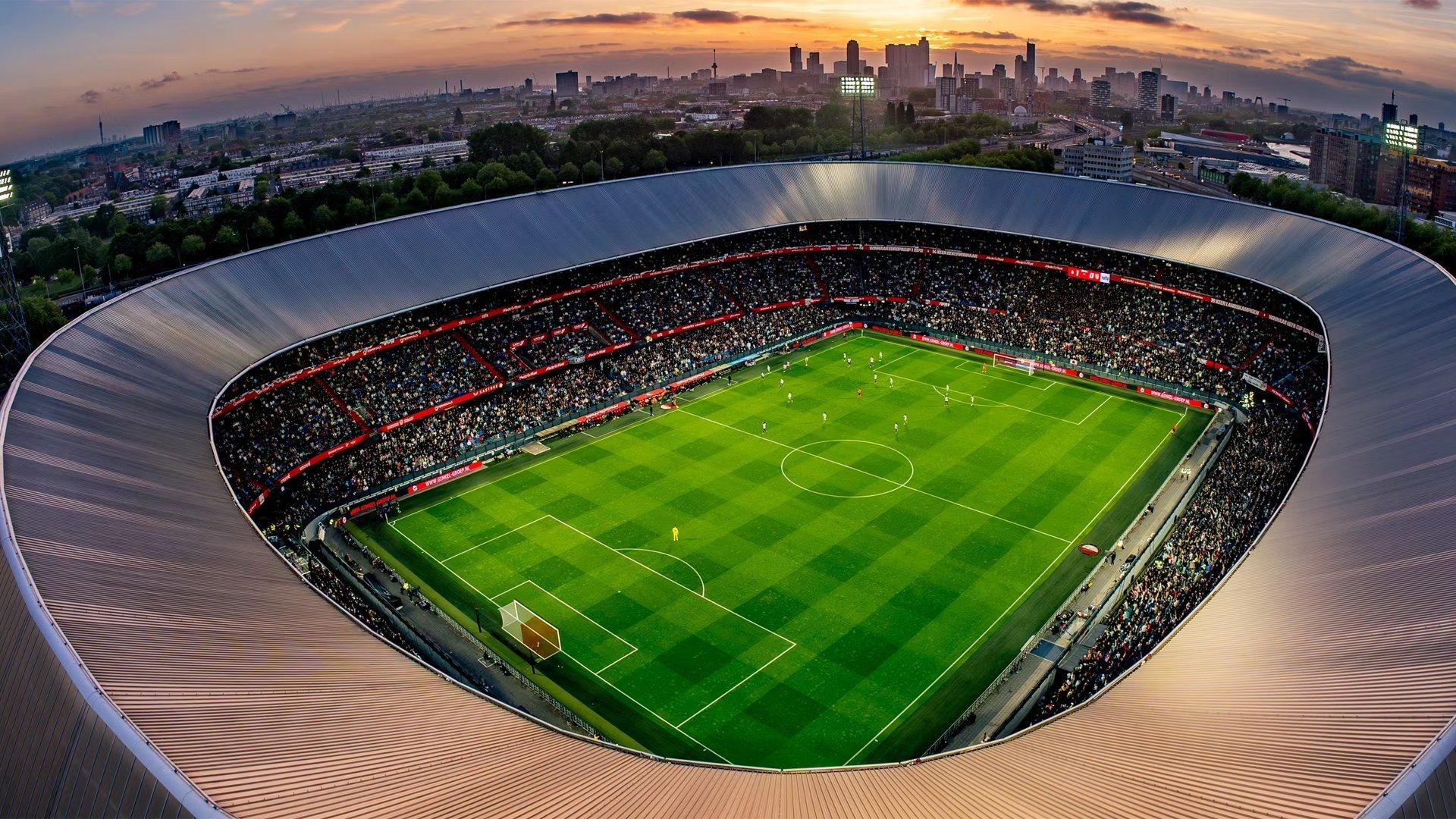 a soccer stadium with a large crowd of people in it