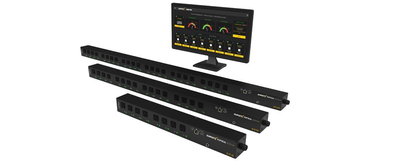 a computer monitor and a bunch of other electronics on a table