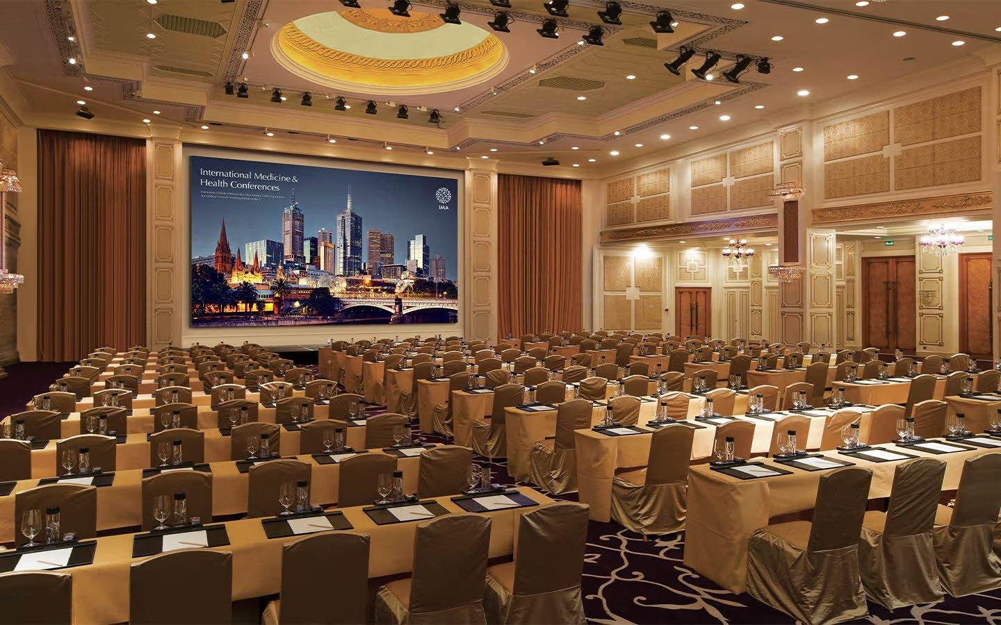 a large painting of a city skyline hangs over a conference table