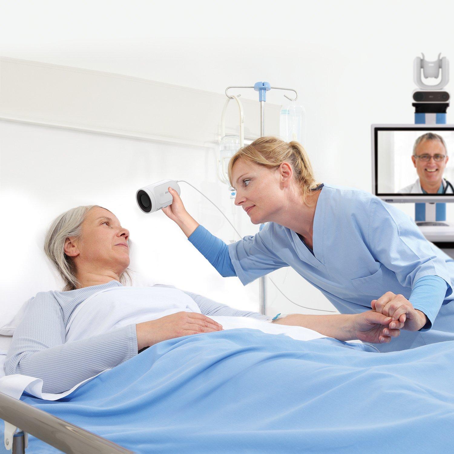 hospital room with nurse checking patient