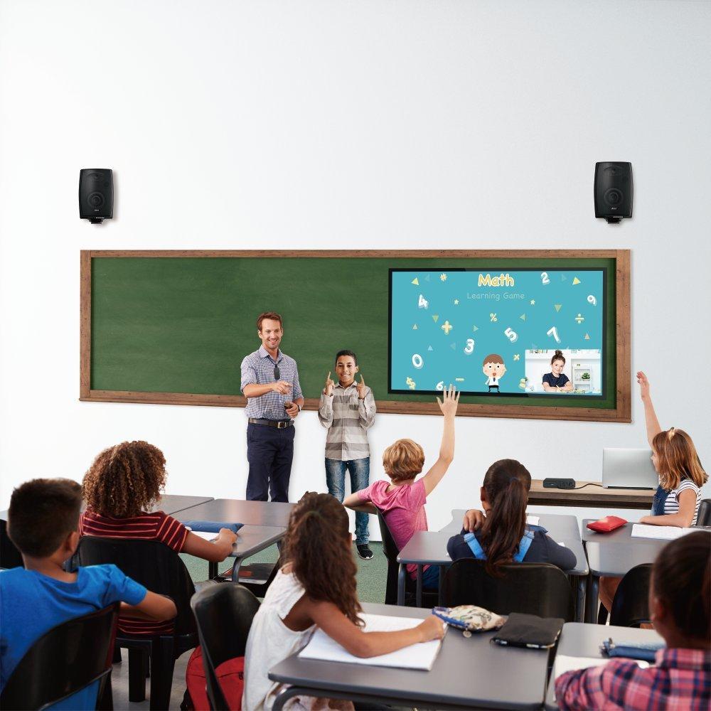 classroom full of people listening to teacher
