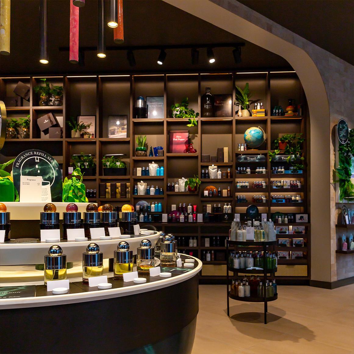Molton Brown store interior with eau de parfum bottles in the foreground.