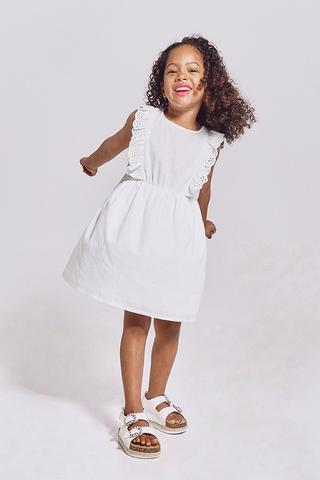 Beautiful Little Girl in a White Short Dress with a Black Belt