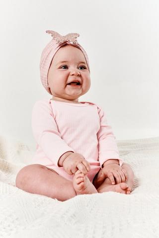 Baby's frilly knickers in ivory, white or pink in sizes from birth to 2  years.