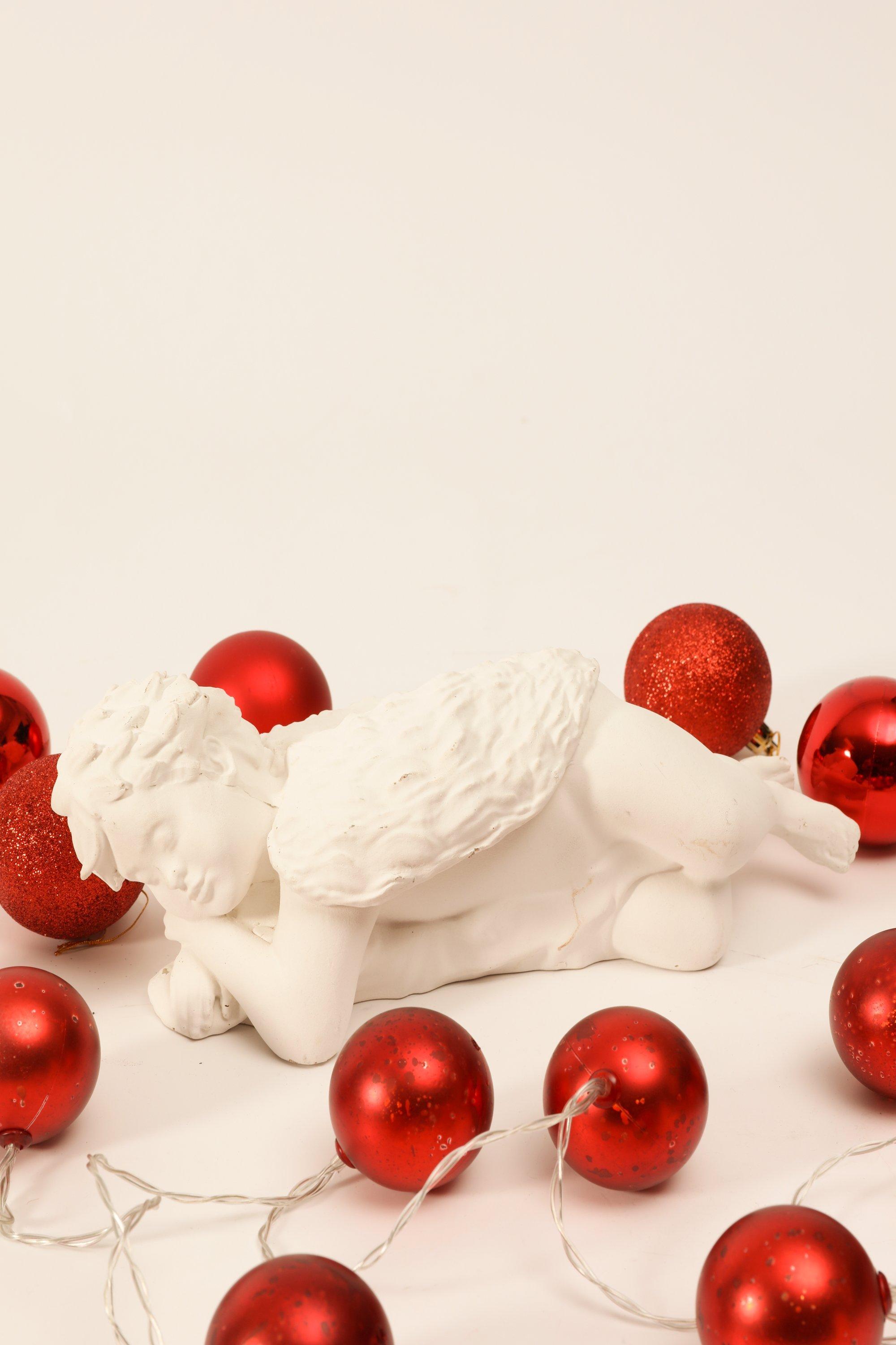 Resting Cherub Statue