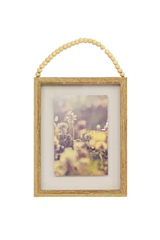 DECORATIVE FRAME WITH HANGING BEADS
