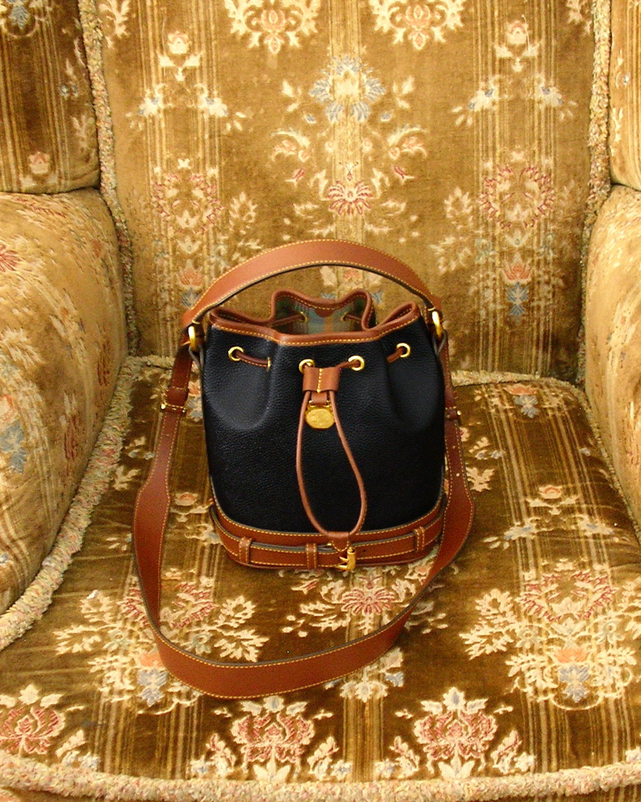 Scotchgrain mini bucket bag on armchair