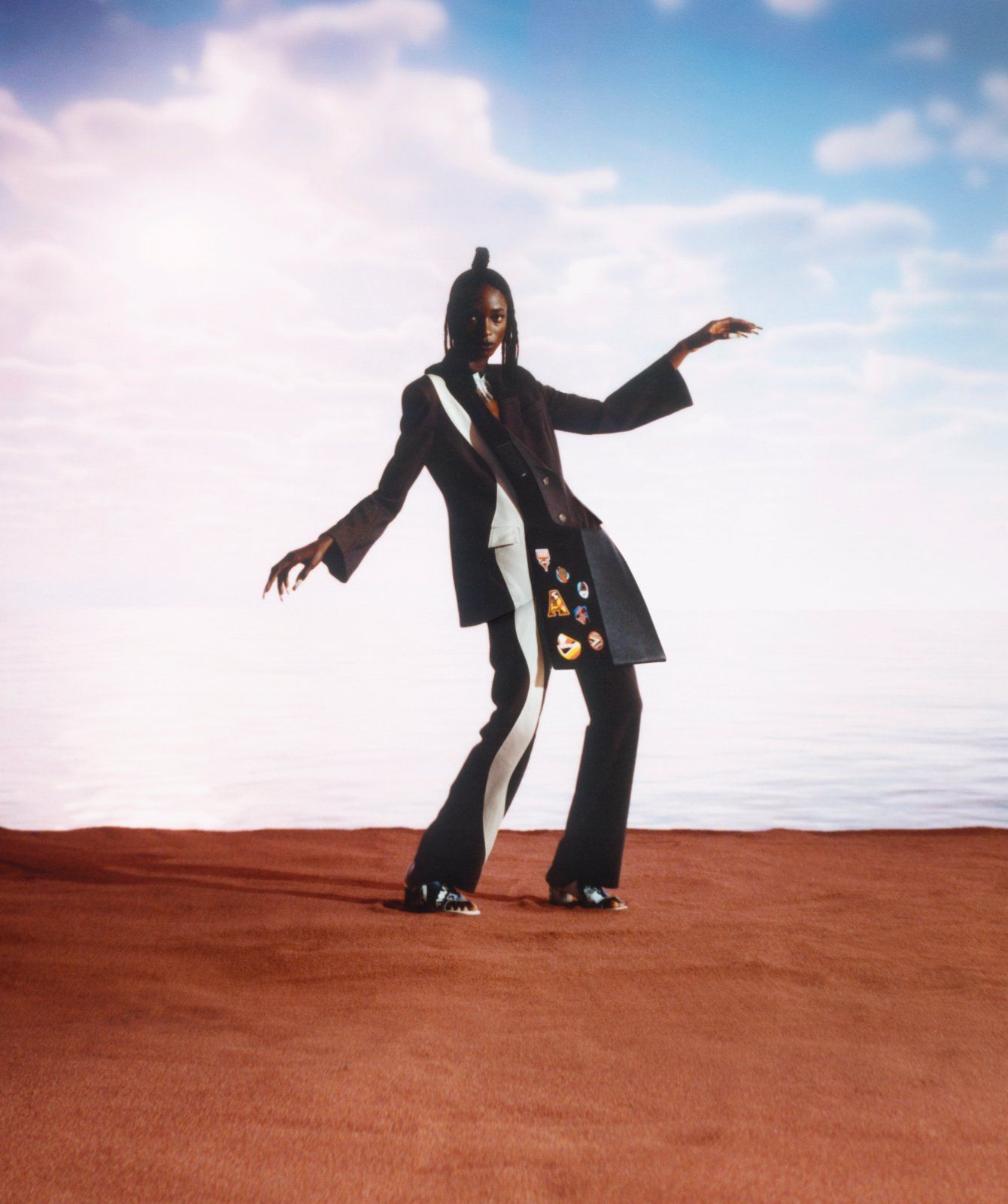 Model wearing a black and white suit