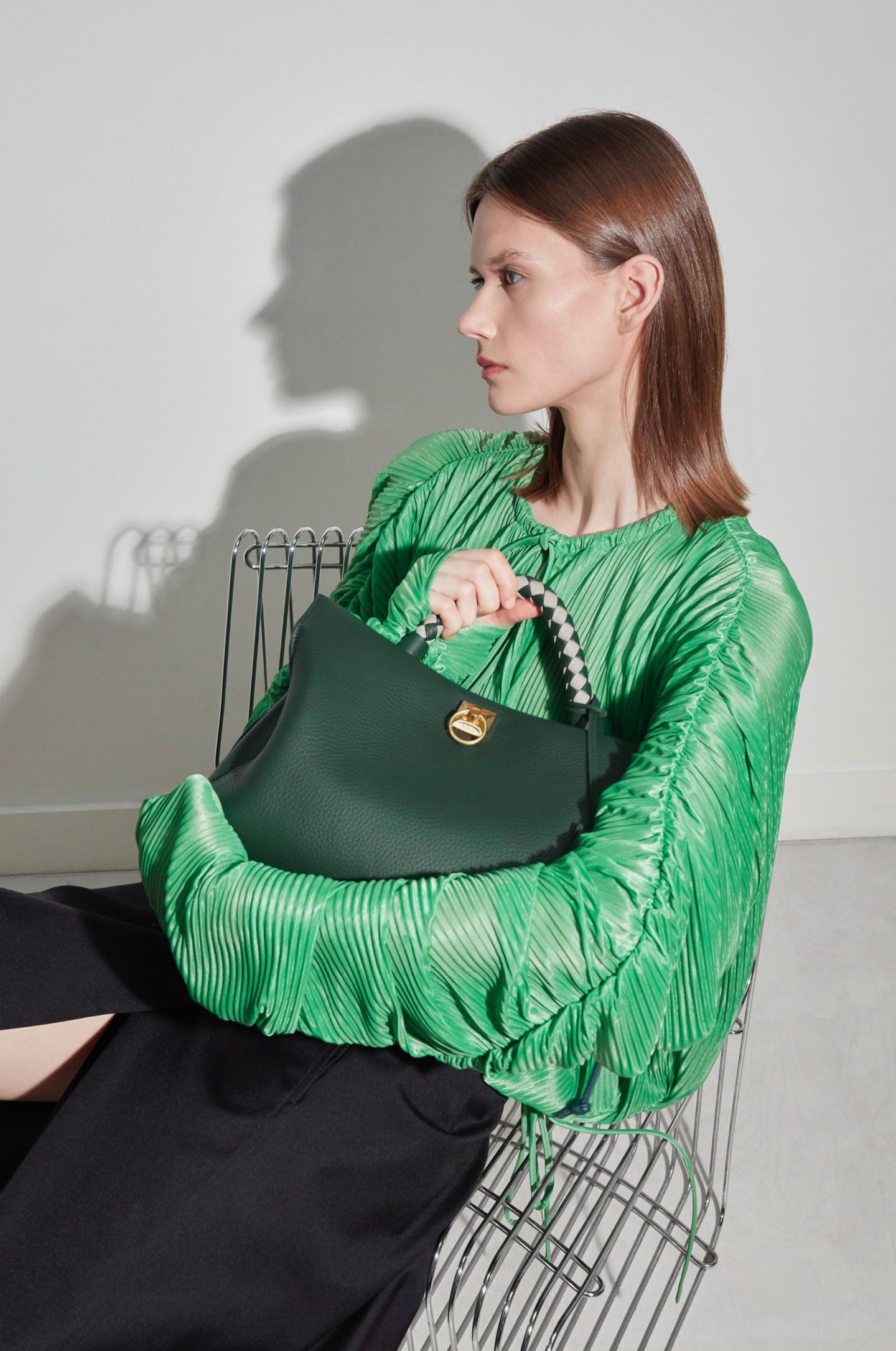 model holding mulberry Iris bag in Mulberry Green Heavy Grain