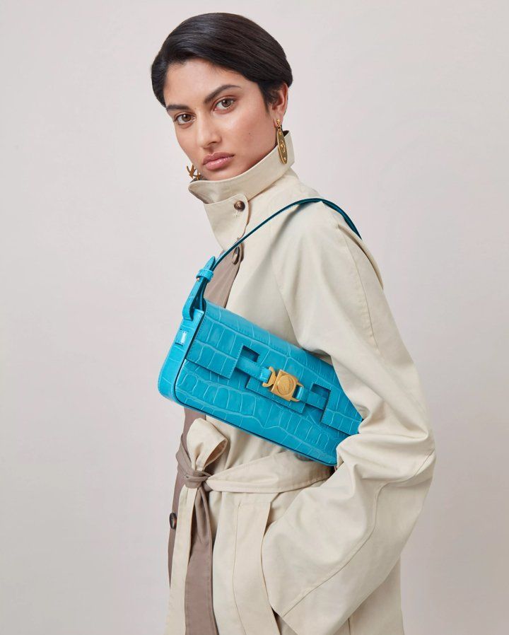 model wearing Axel Arigato for Mulberry Shoulder Bag in azure blue