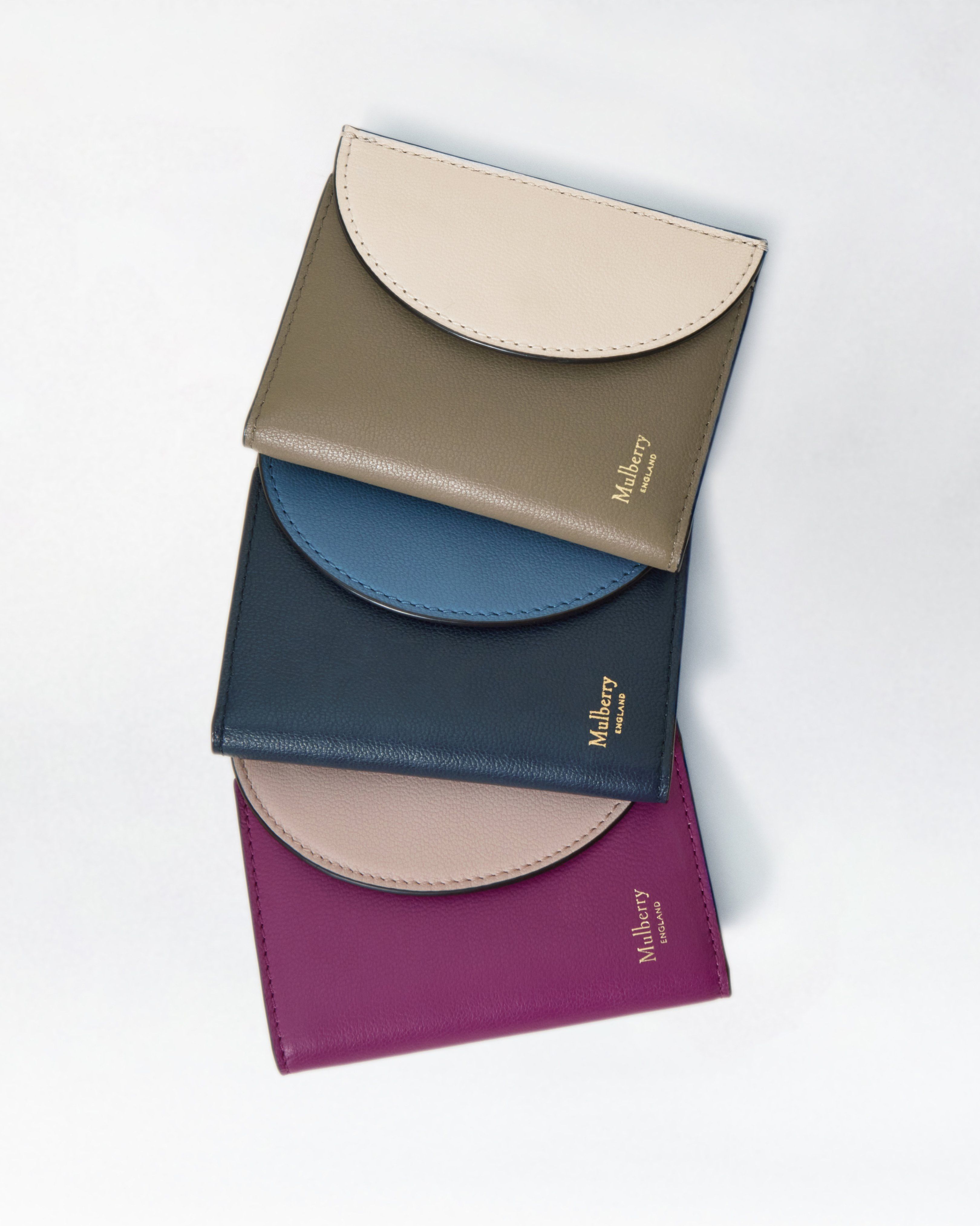 Trio of Mulberry folded wallets in green, blue and pink leather