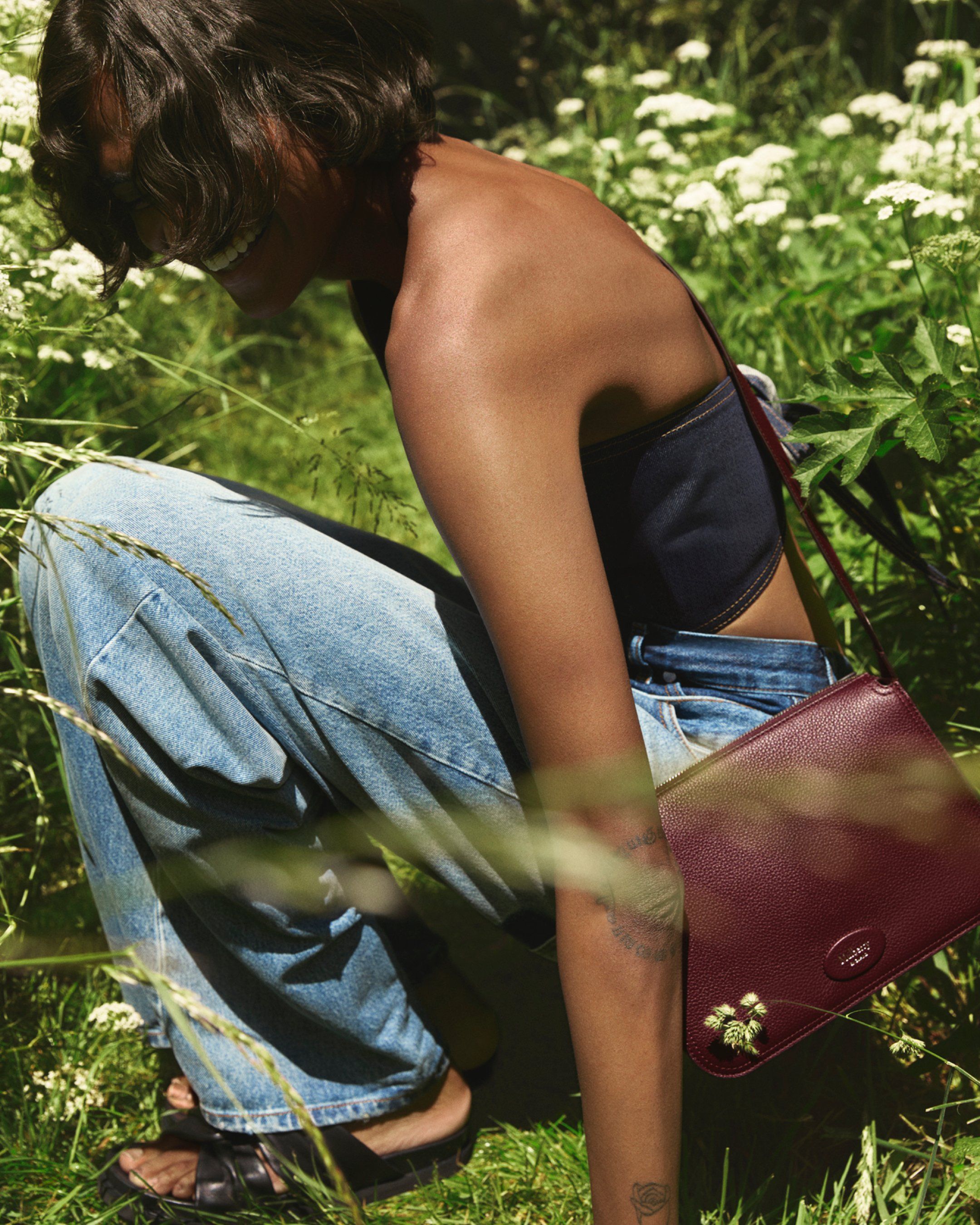 Model wearing Mulberry Billie bag in Black Cherry