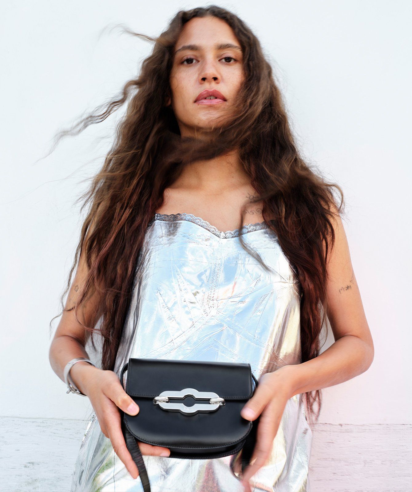 Model holding the Mulberry Small Pimlico Satchel in black leather