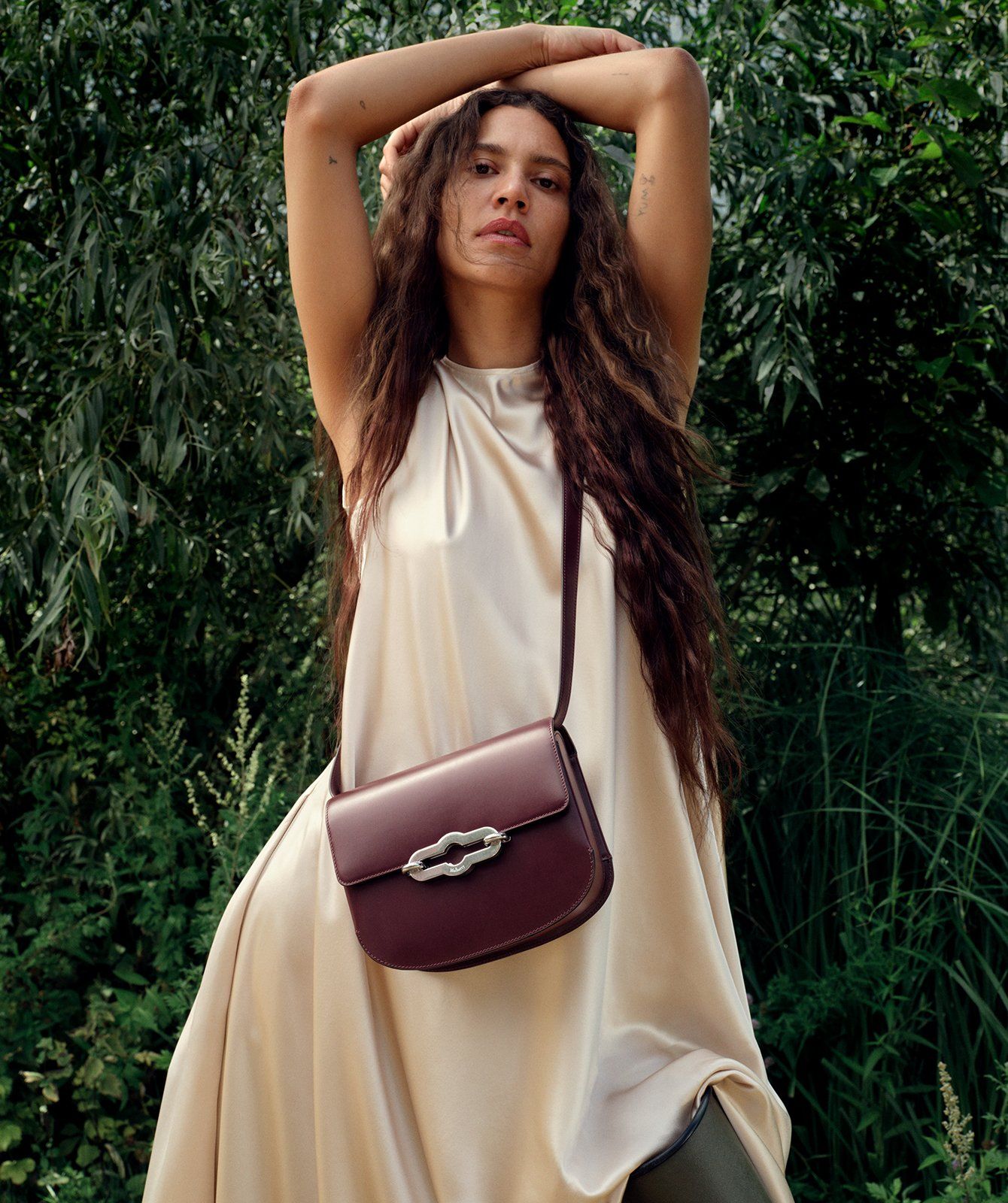 model wearing Mulberry Pimlico Satchel bag in dark cherry