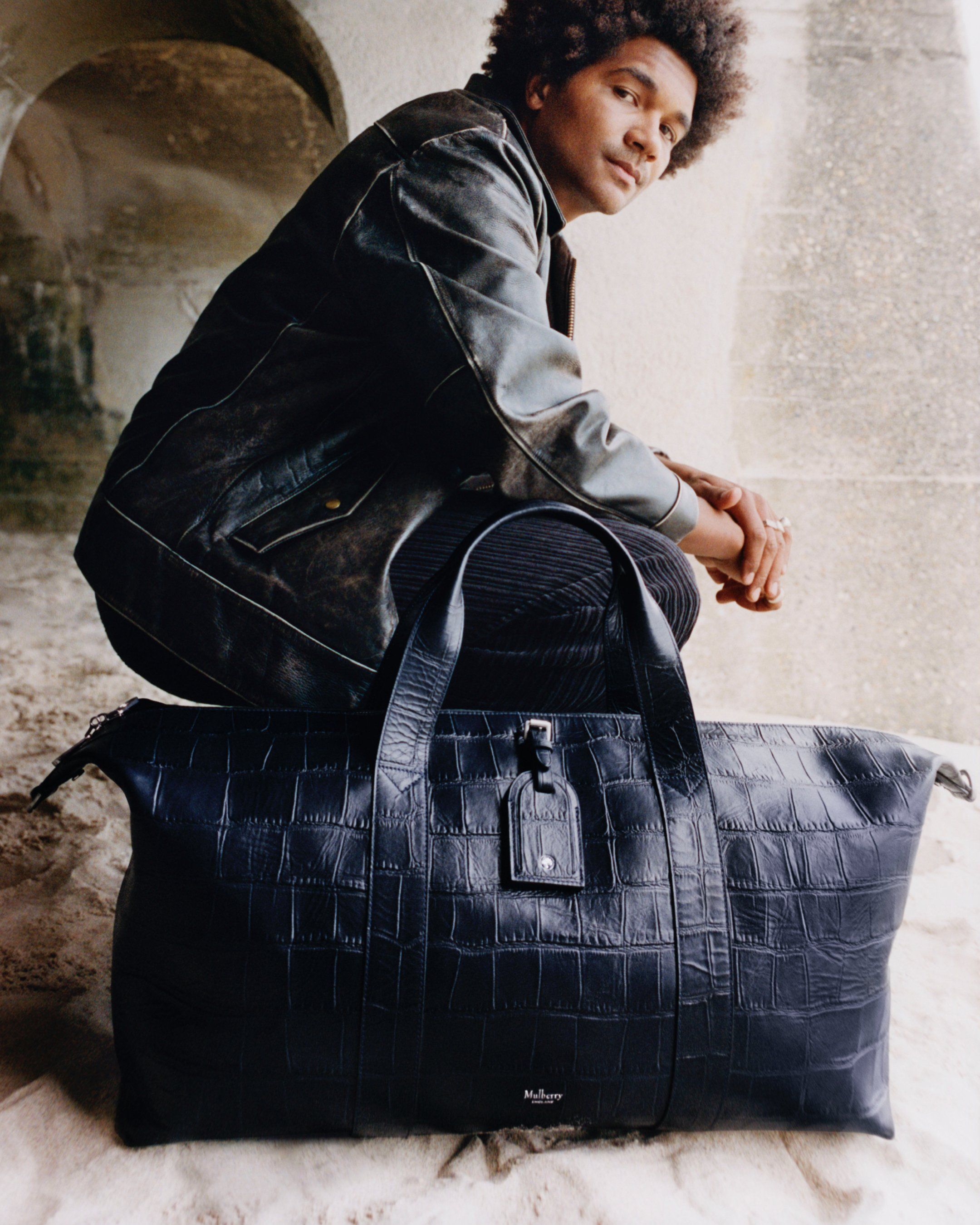 Model with the Mulberry Clipper bag in navy leather with croc print
