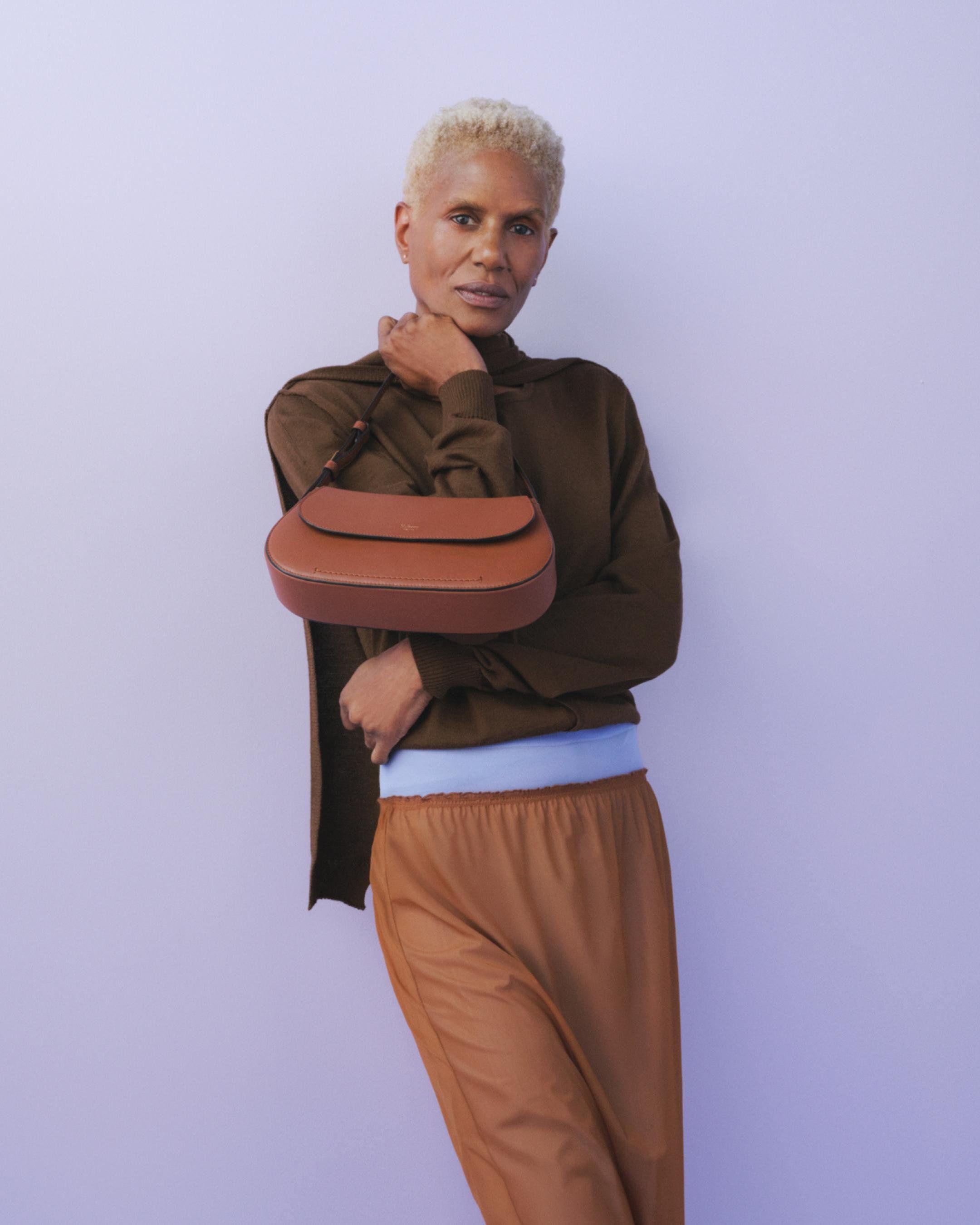 Model holding the Mulberry Clovelly Shoulder Bag in brown leather