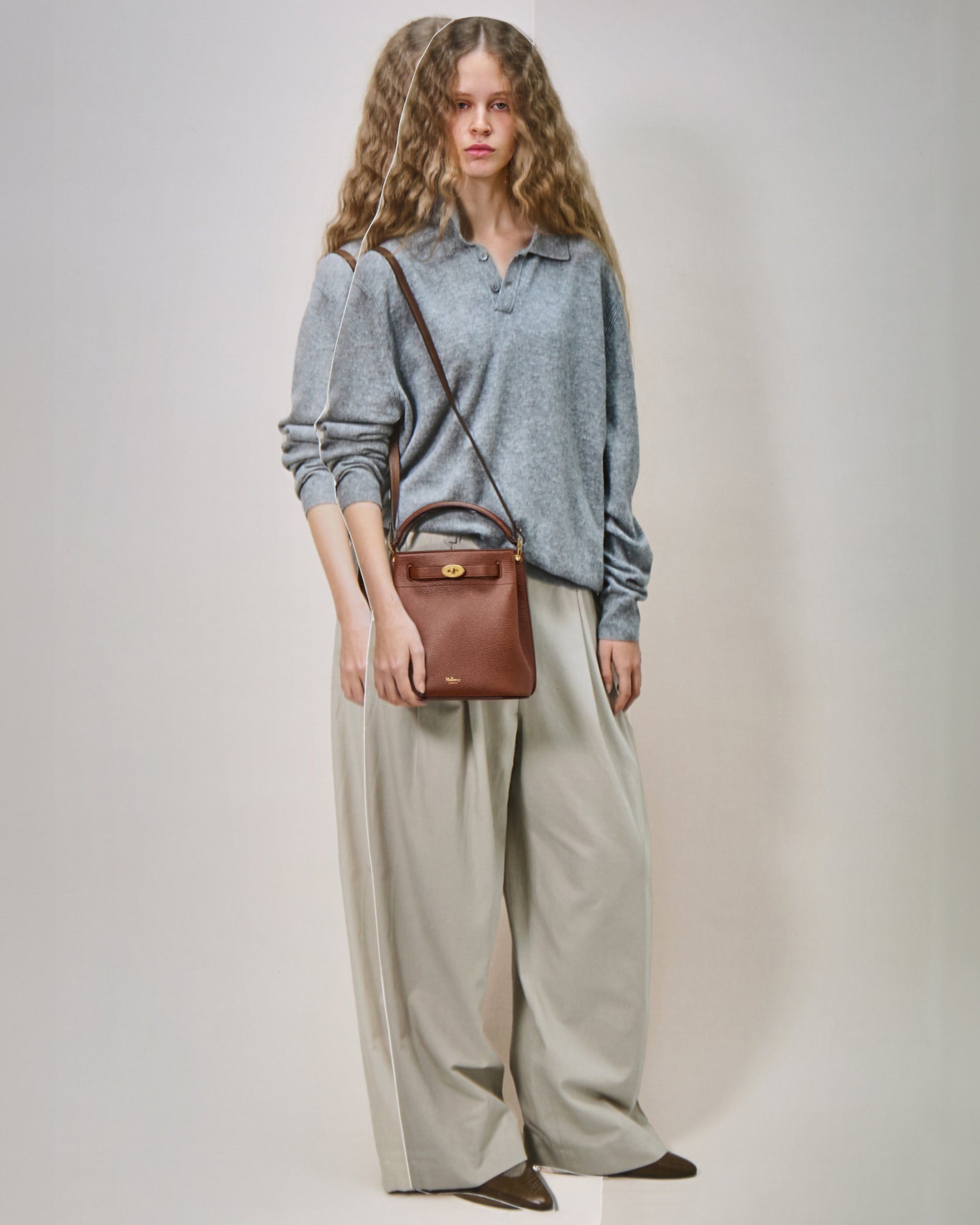 Model wearing the Mulberry Islington Bucket bag in brown leather