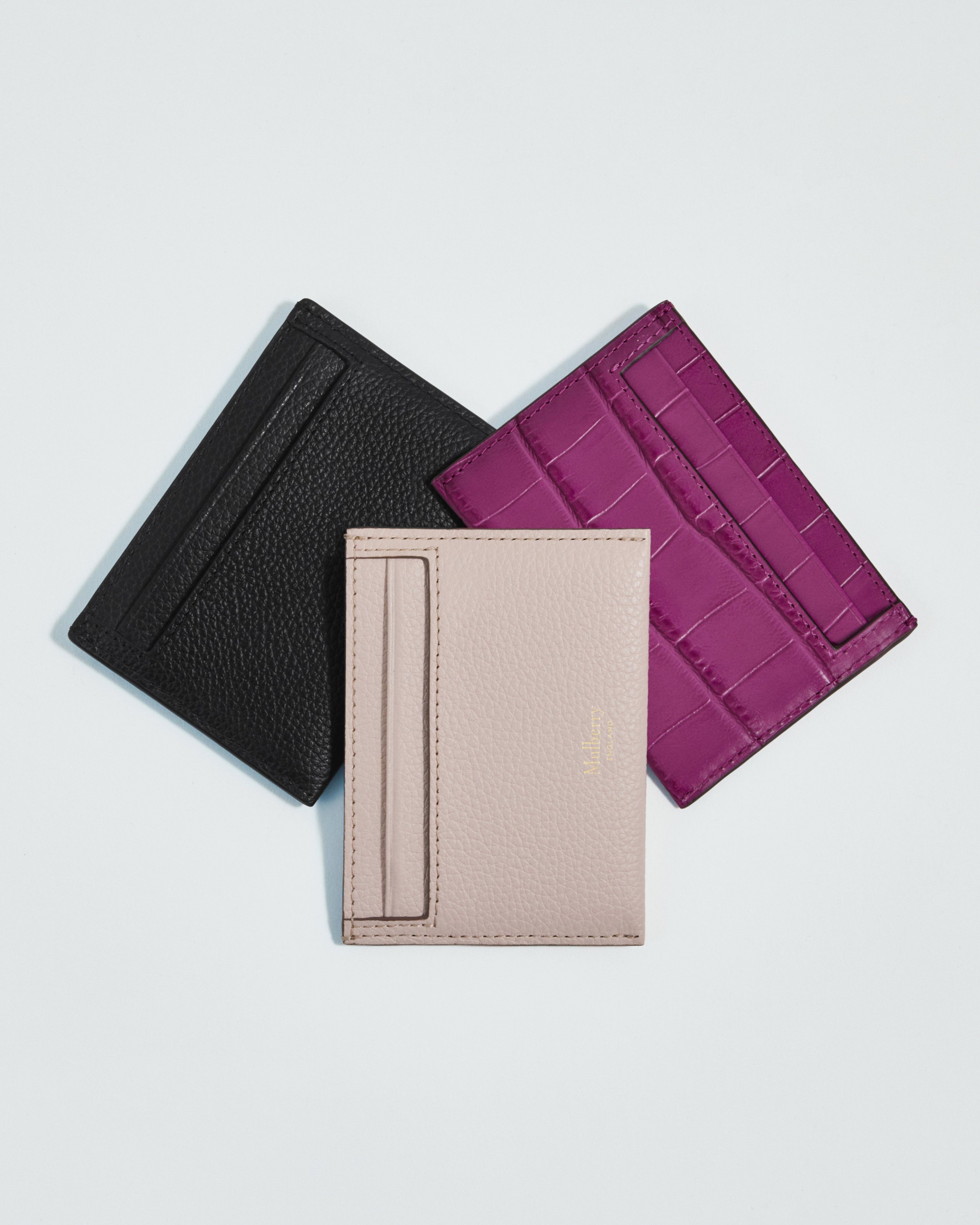 Three Mulberry card holders in pink and black leather