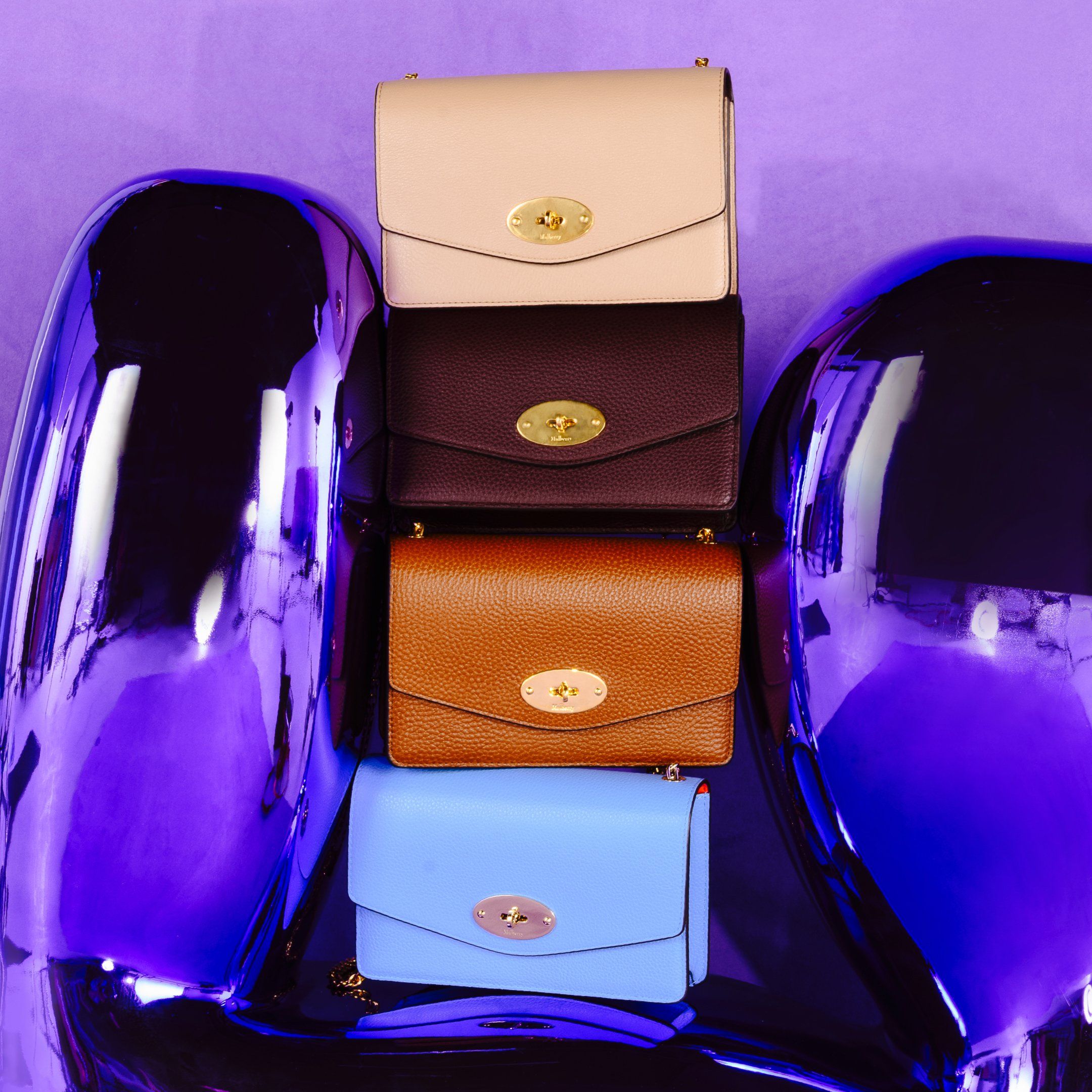Four Mulberry Darley handbags in blue, brown, oxblood and maple