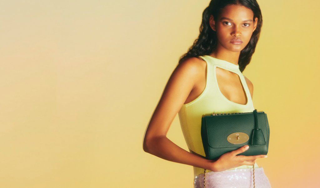 Model holding a green Mulberry Lily bag