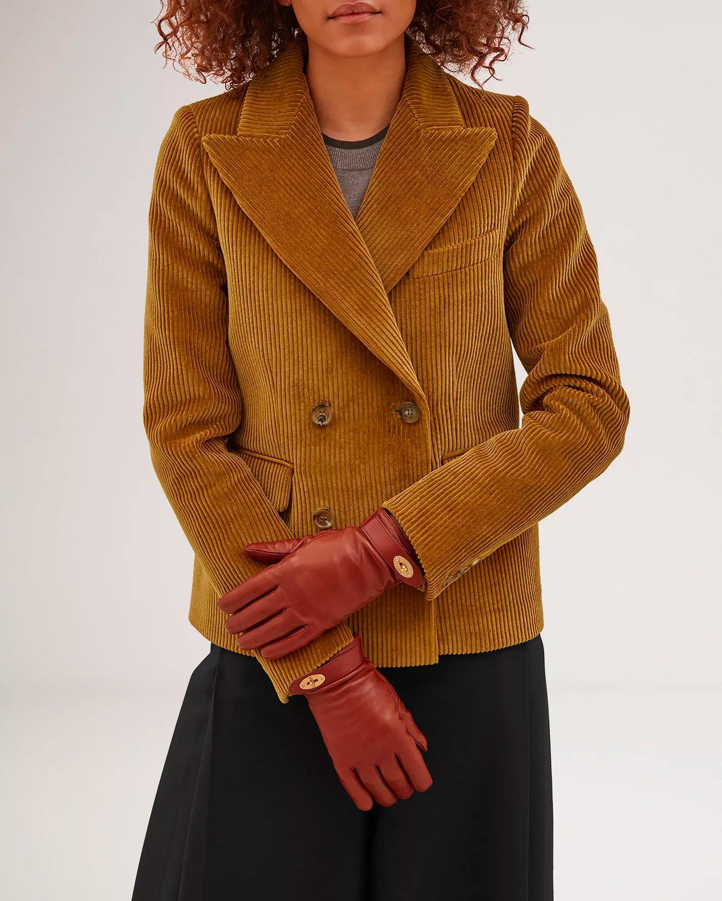 Model wearing Darley gloves in maroon leather