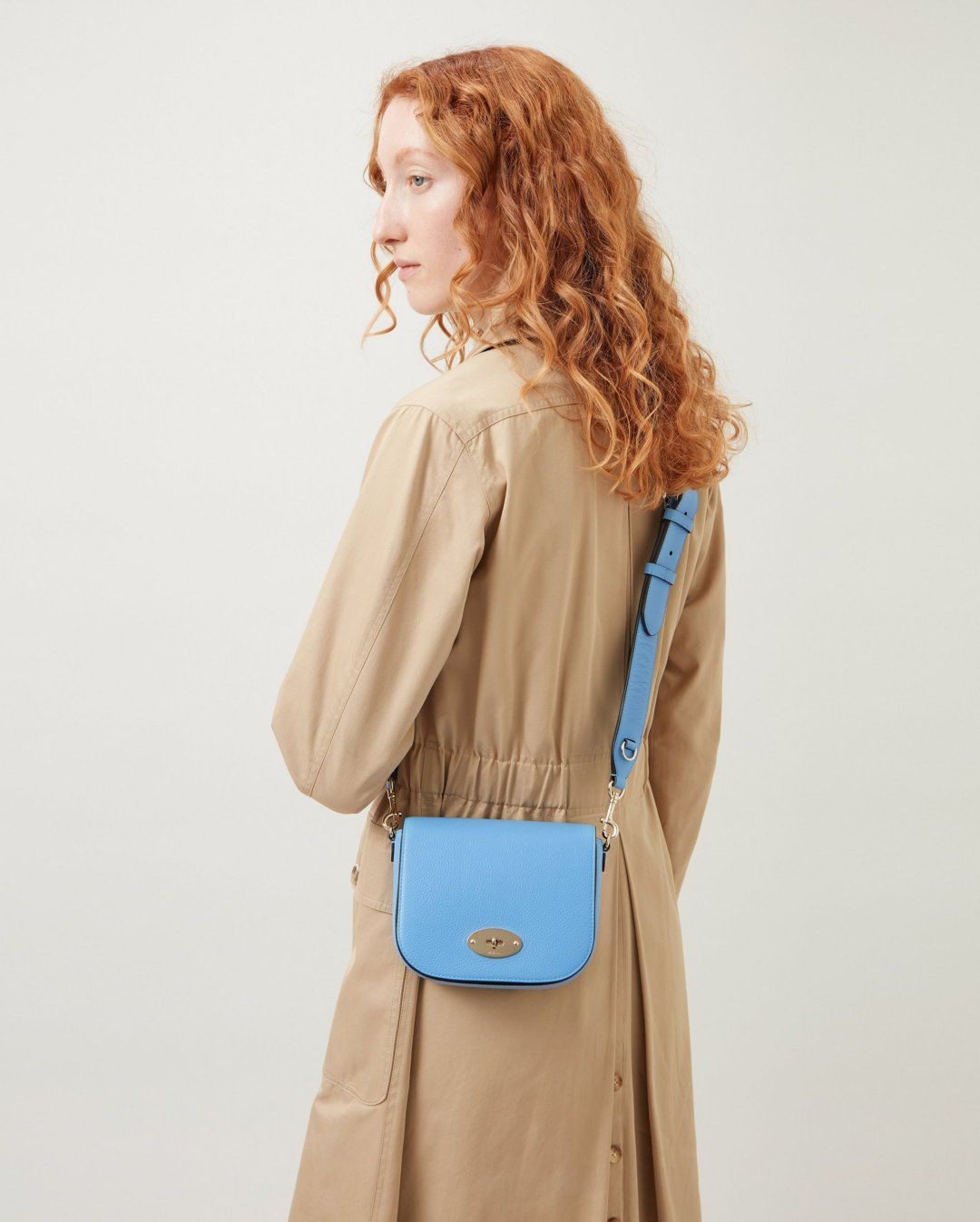 Model wearing Small Darley Satchel in Cornflower Blue Small Classic Grain