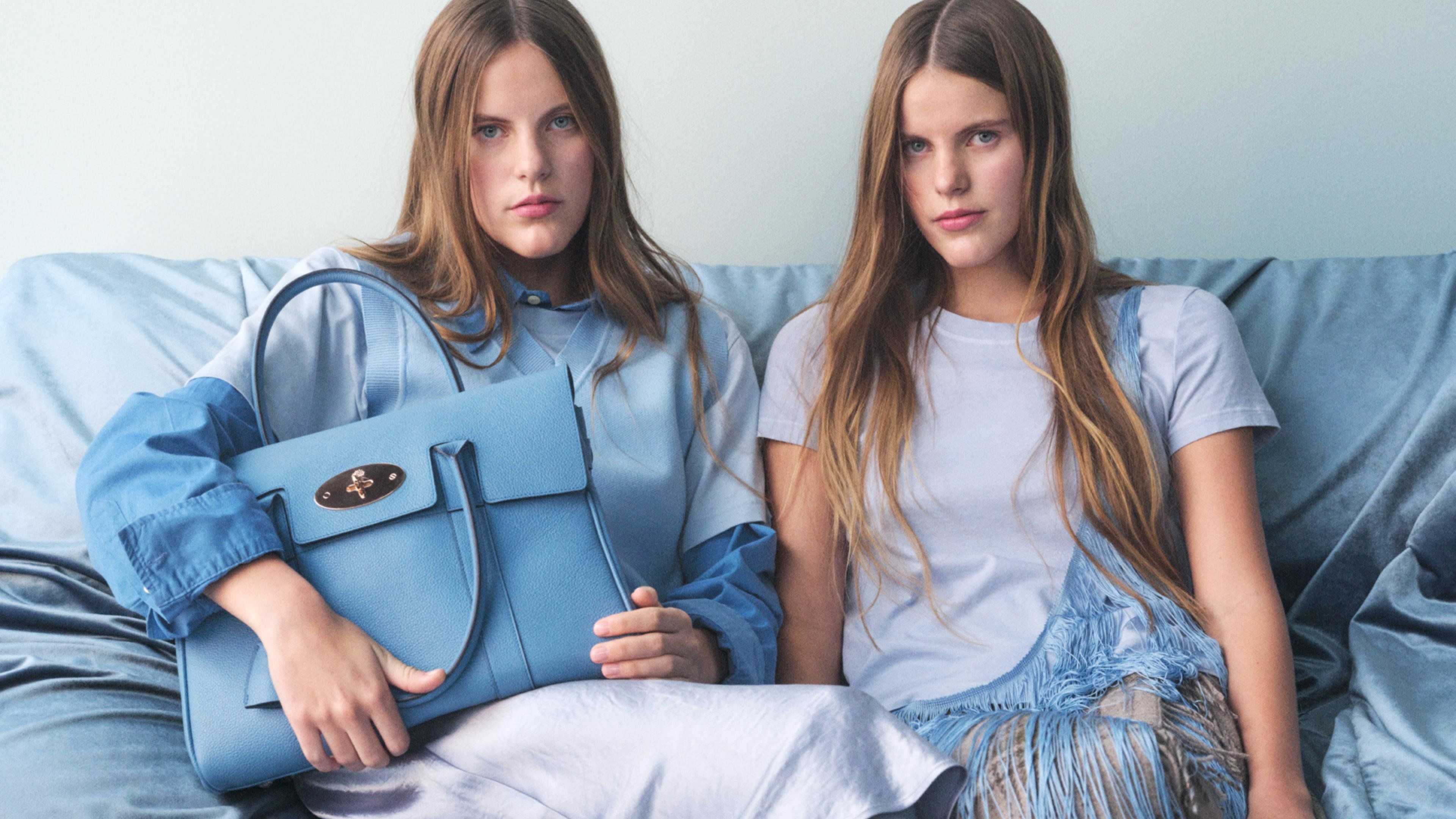 Models wearing Mulberry Bayswater handbag in blue leather