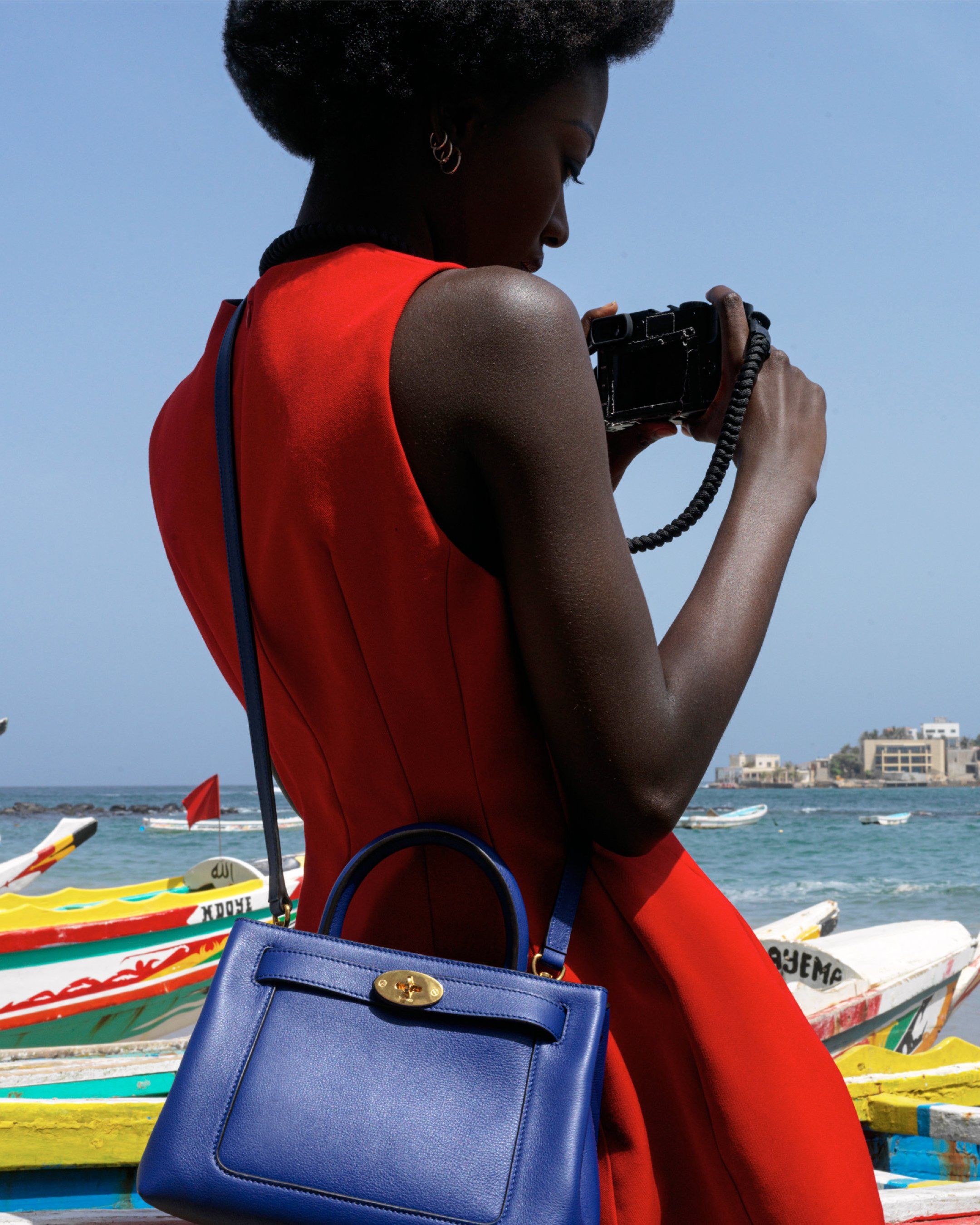 Model wearing Mulberry Small Islington bag in Pigment Blue