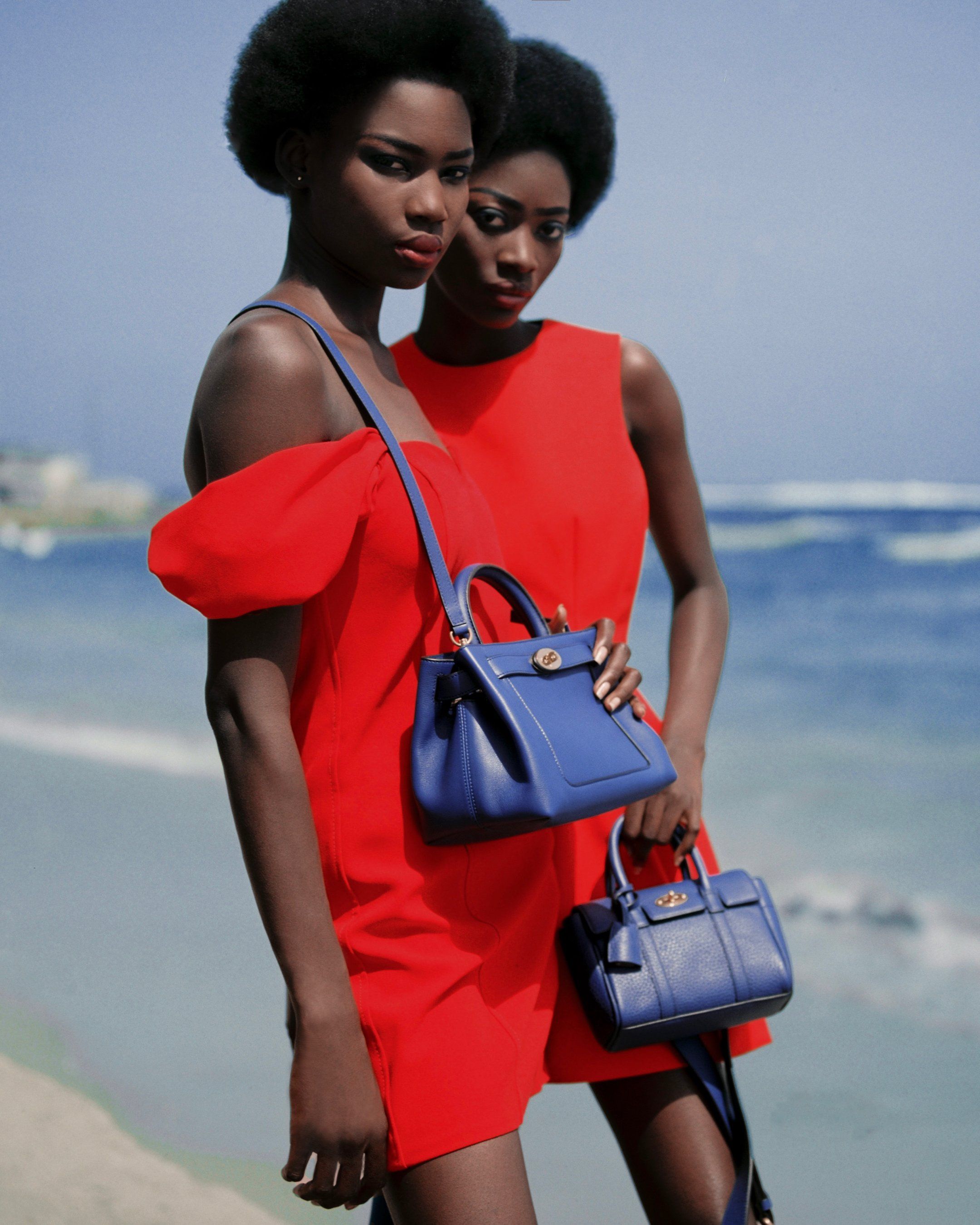 models wearing mulberry small islington bag and mini bayswater bag in pigment blue