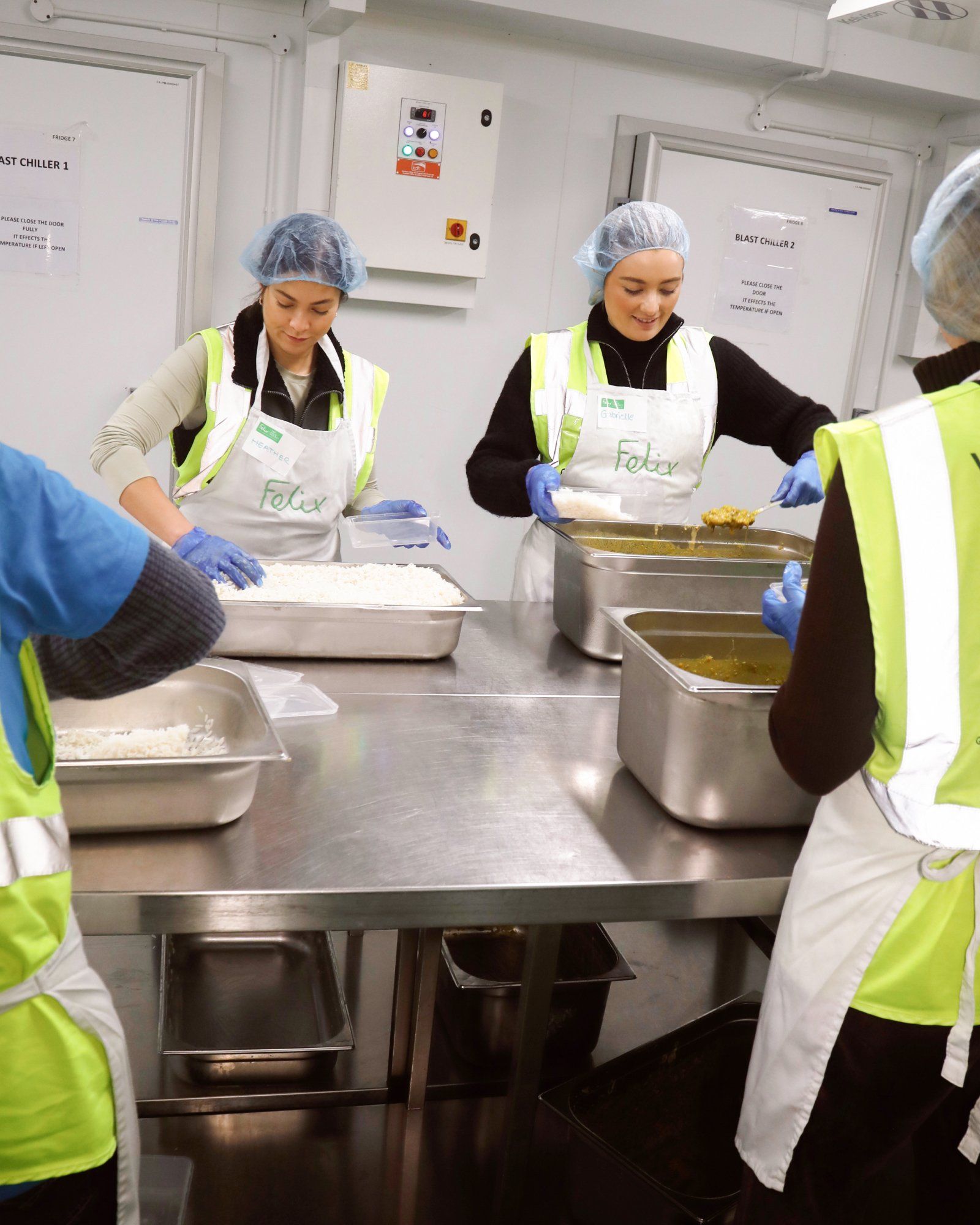 Volunteers preparing food in Felix Project charity kitchen