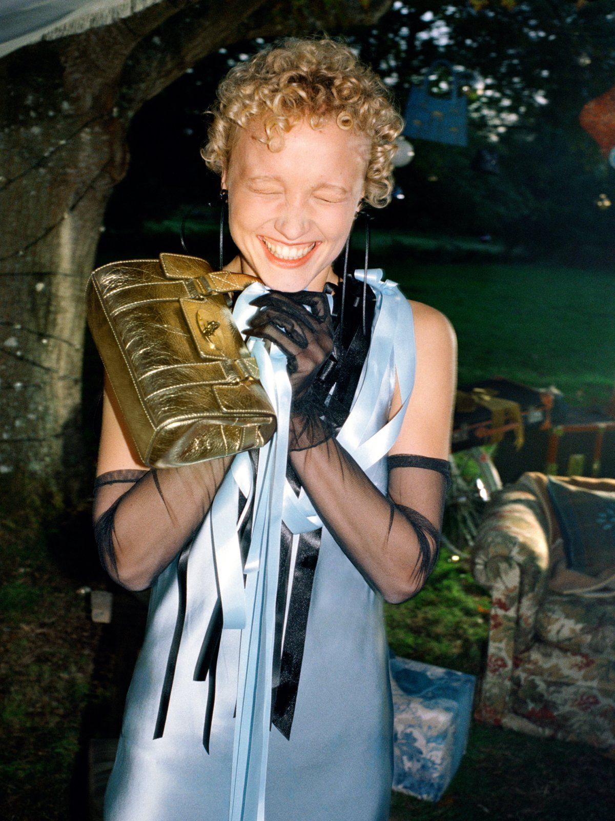 Girl squeezing mini bayswater gold