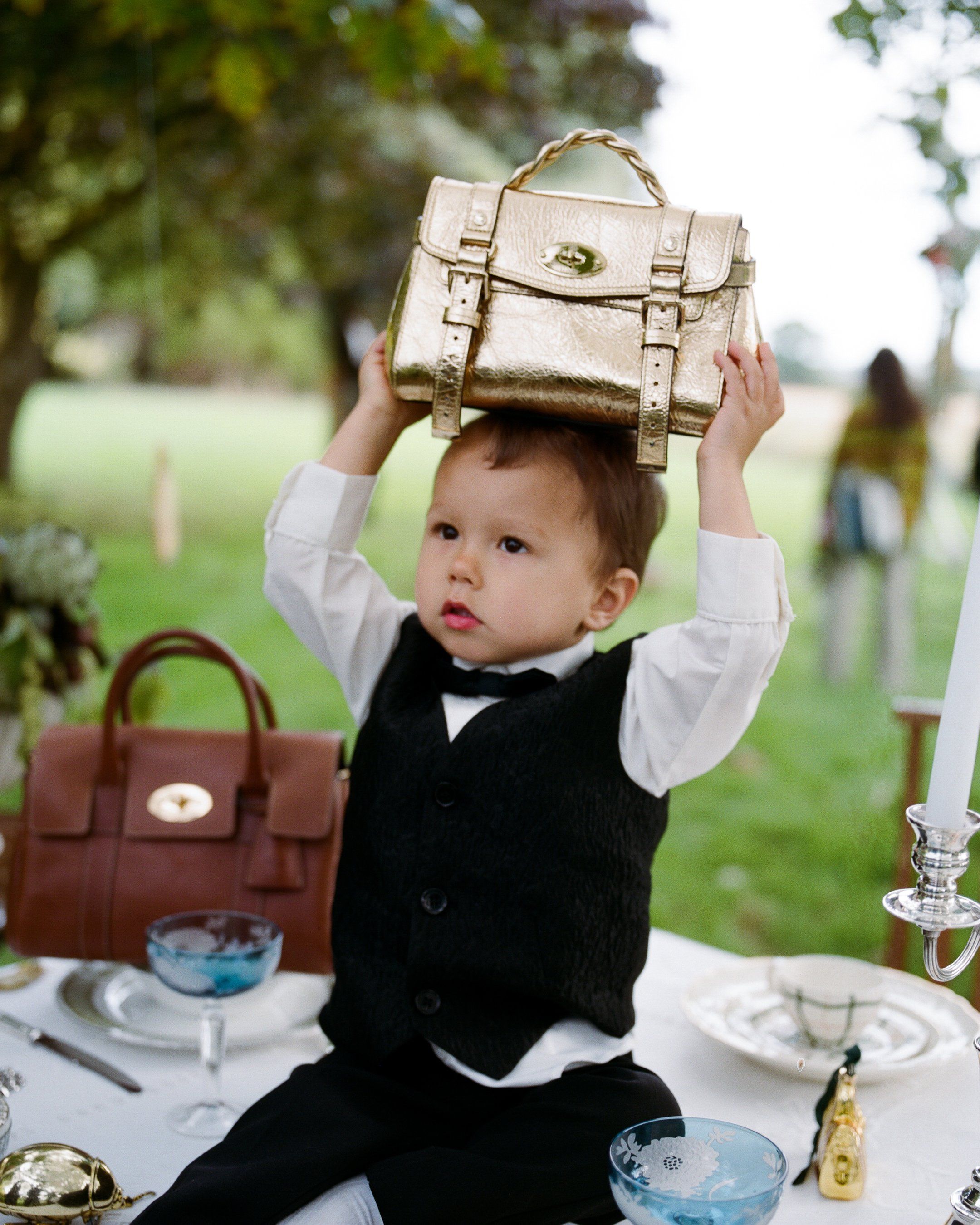 youngBoyHoldingGoldMiniAlexa