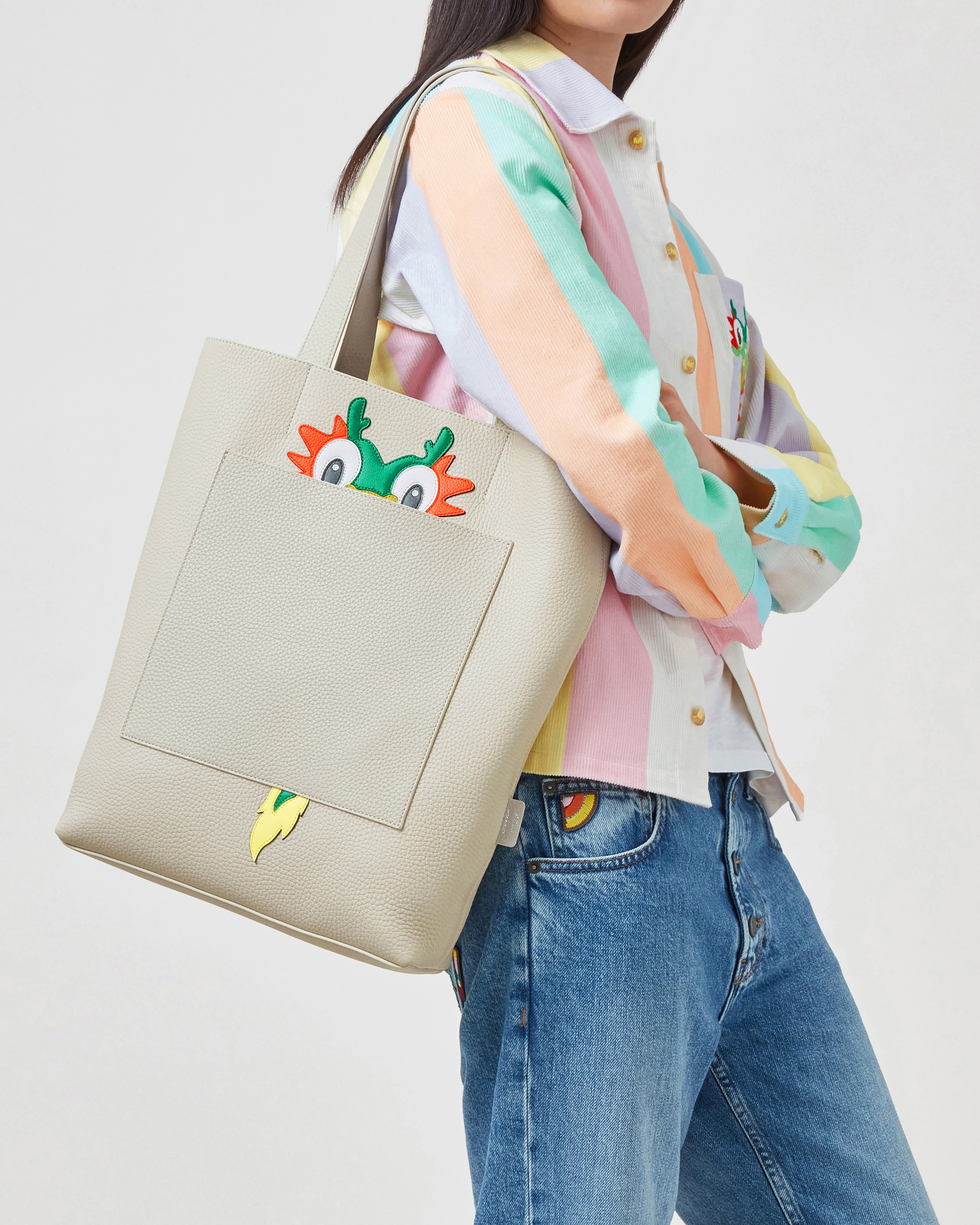 Model wearing Mulberry x Mira Mikati Leather tote with dragon panel in chalk