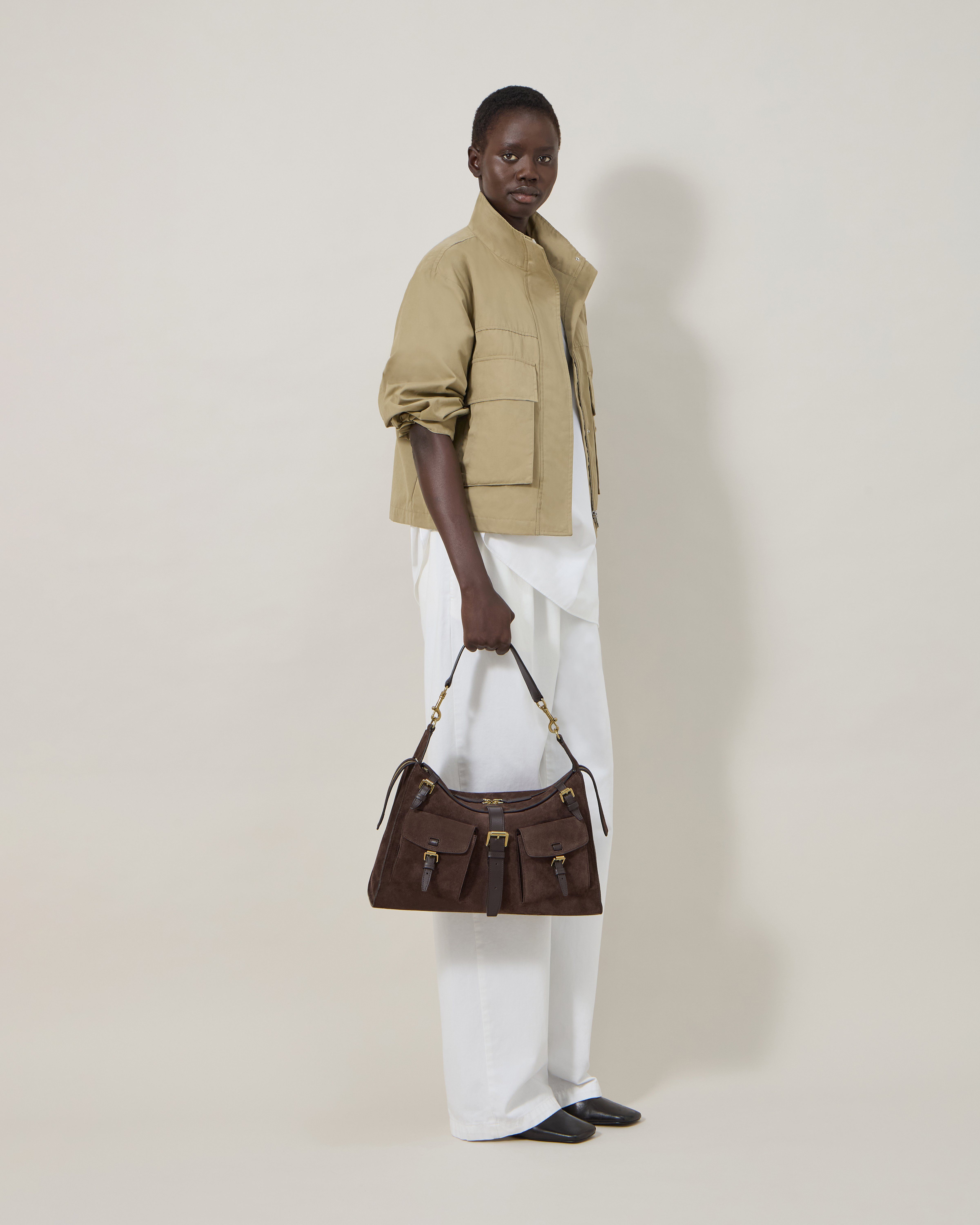 model wearing Mulberry Roxanne shoulder bag in chocolate suede