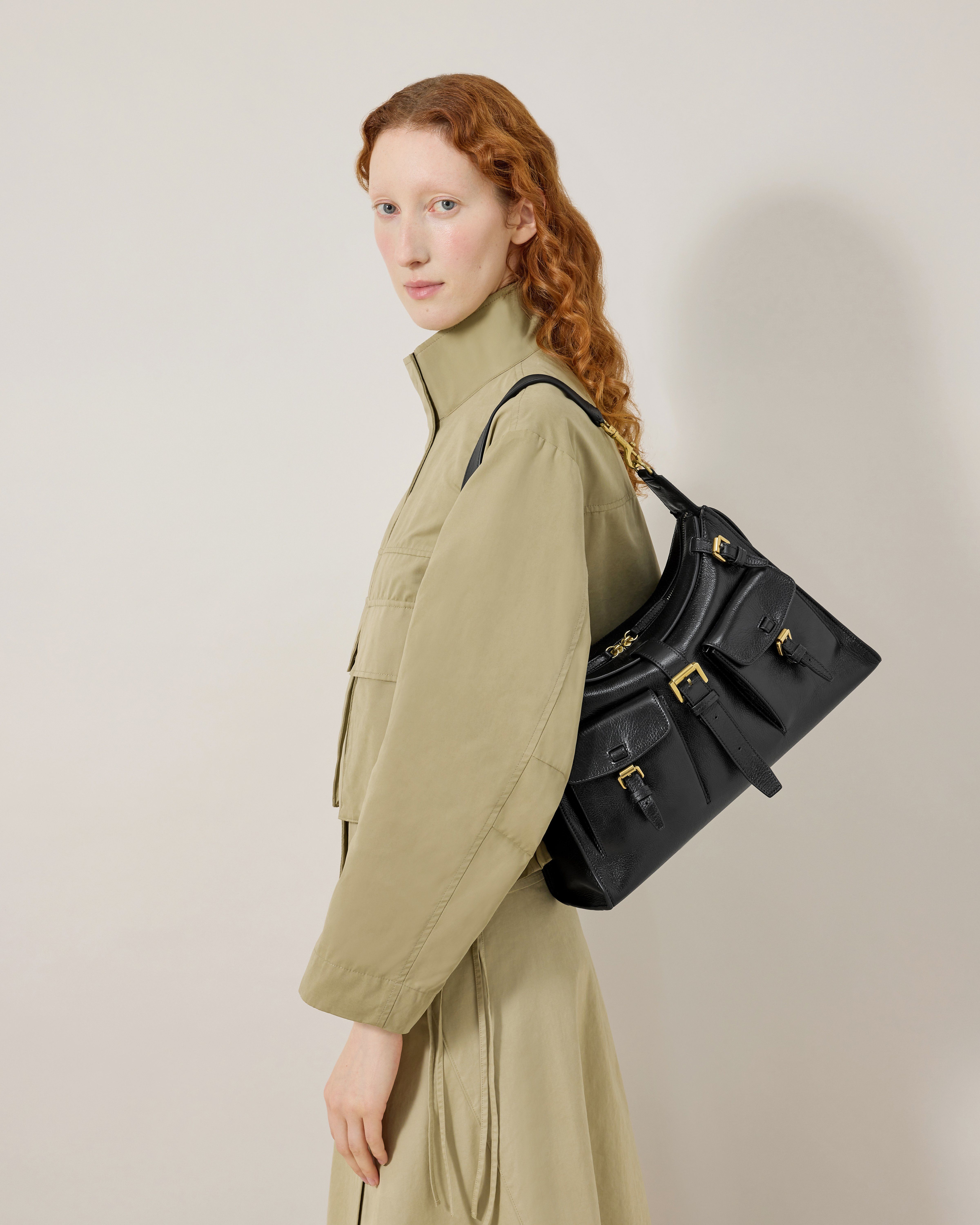 Model wearing Mulberry Roxanne shoulder bag in black
