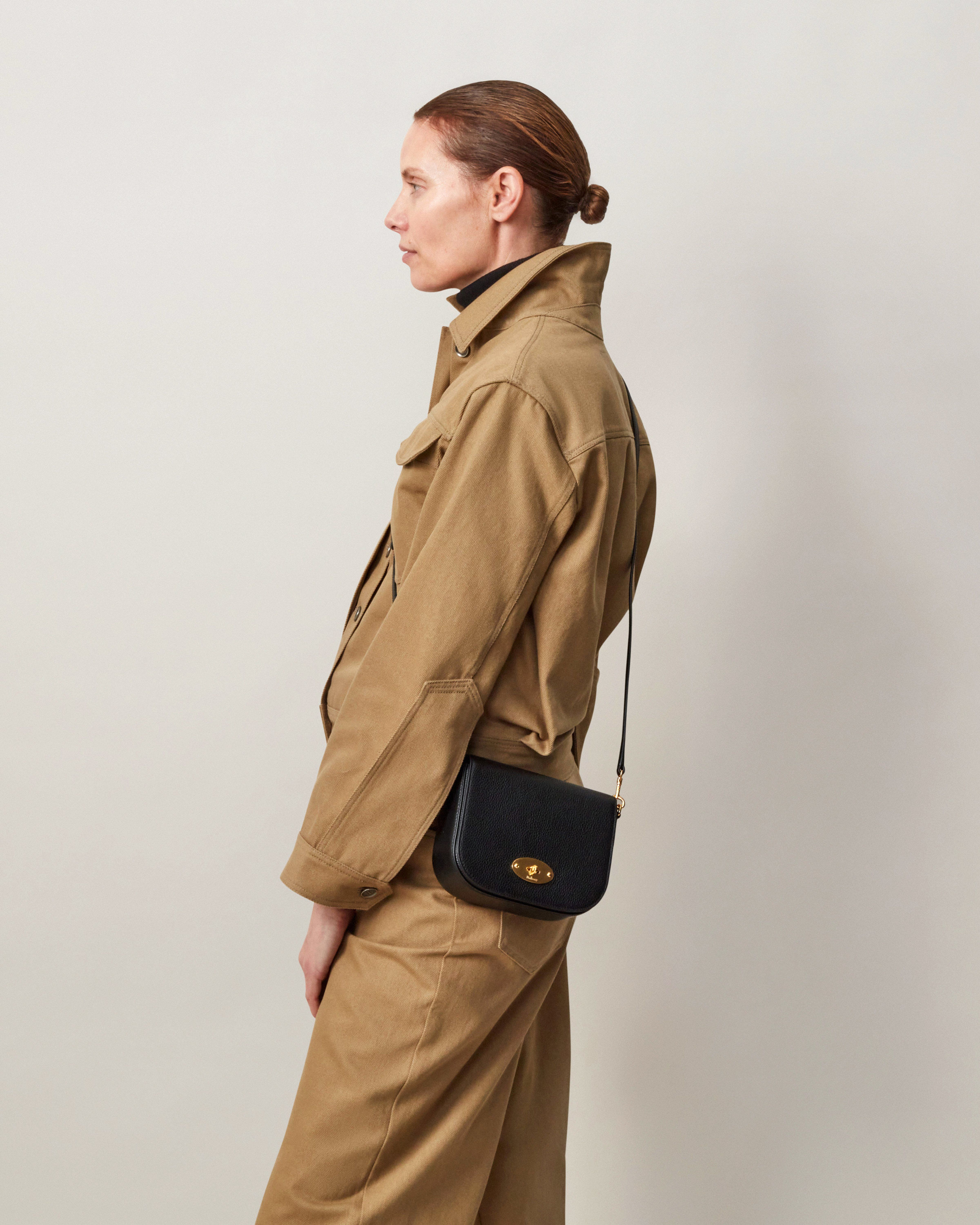 Model wearing Small Darley Satchel in Black Small Classic Grain