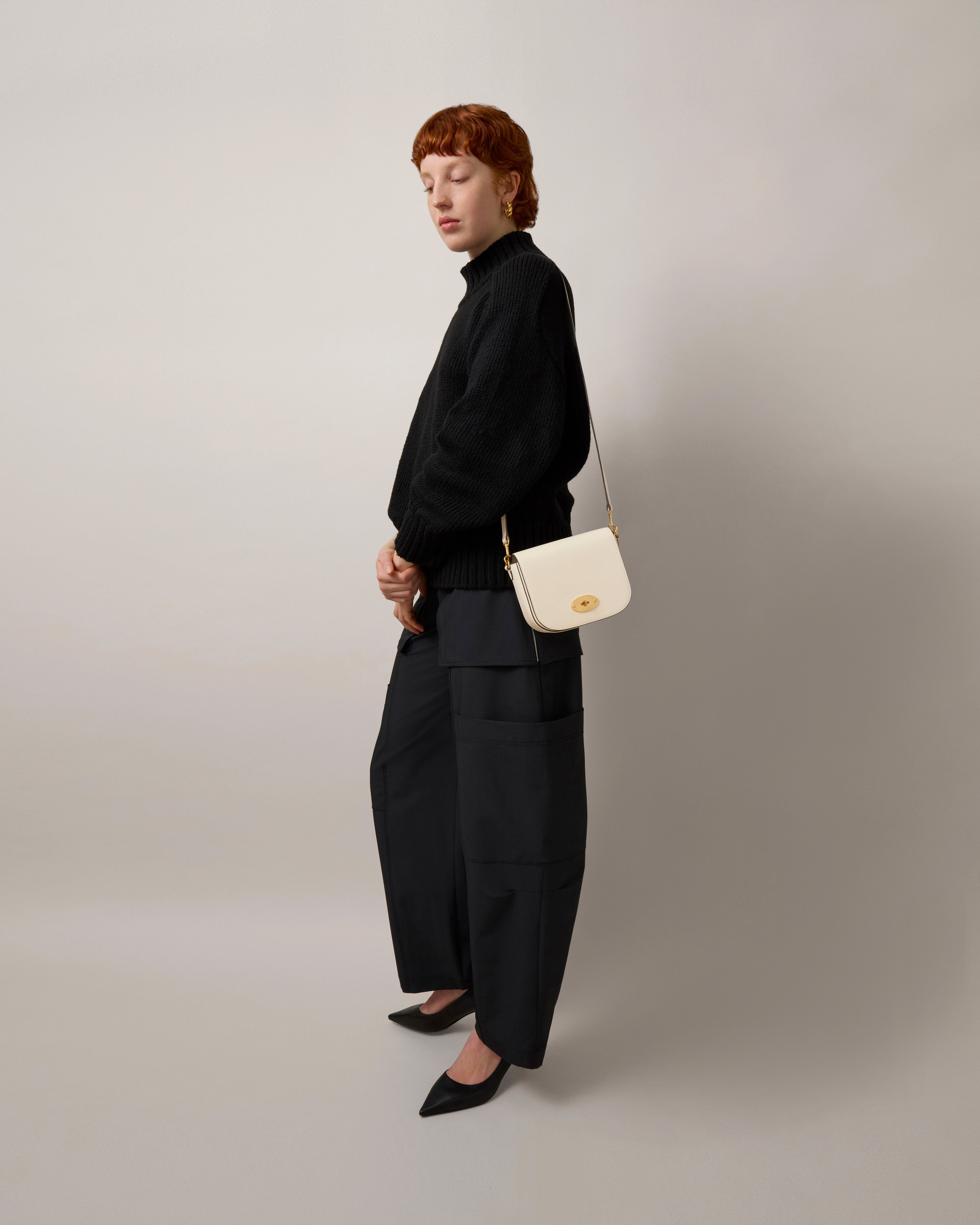 Model wearing Small Darley Satchel in Eggshell Small Classic Grain