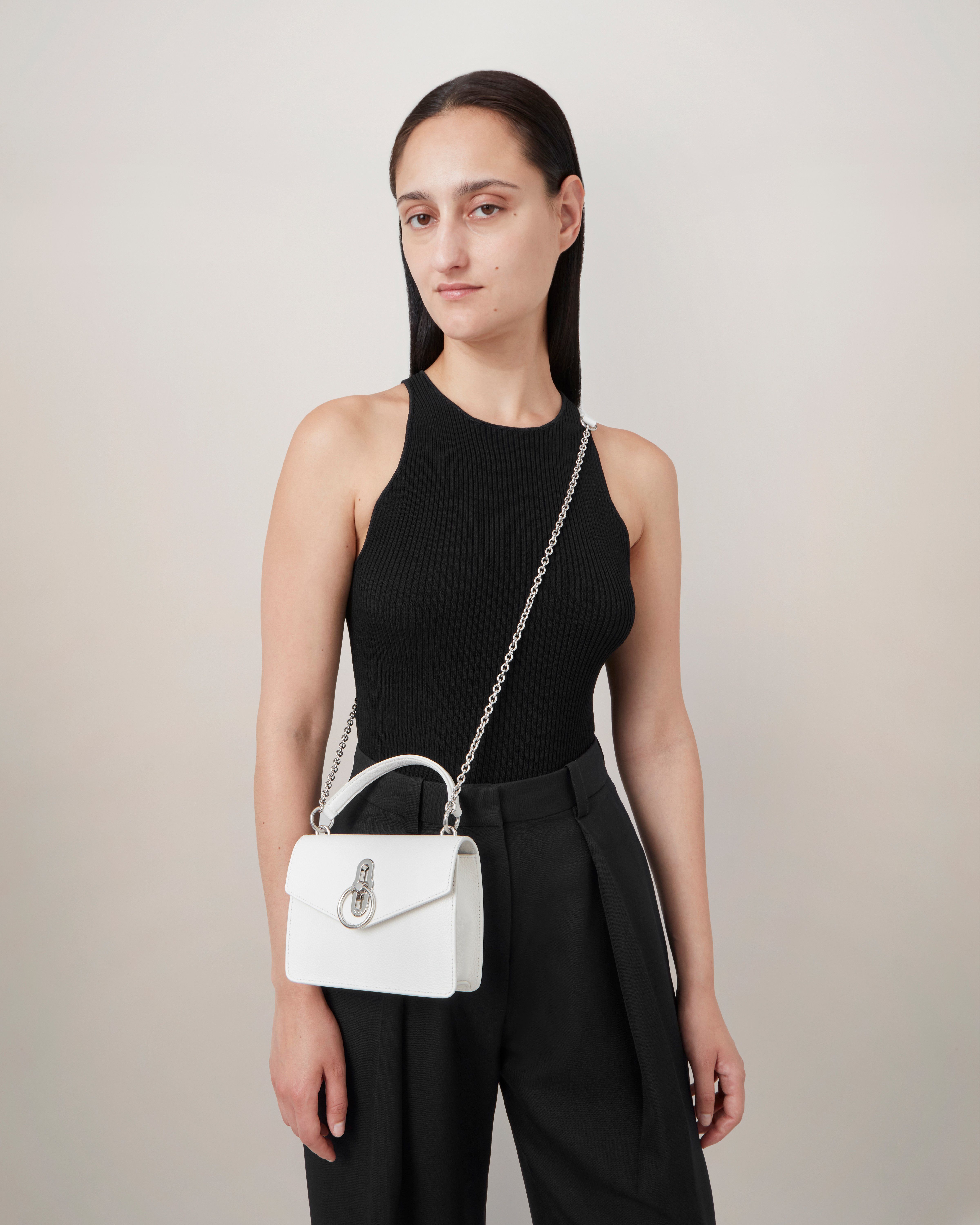 Model wearing the Small Amberley Crossbody in White Small Classic Grain