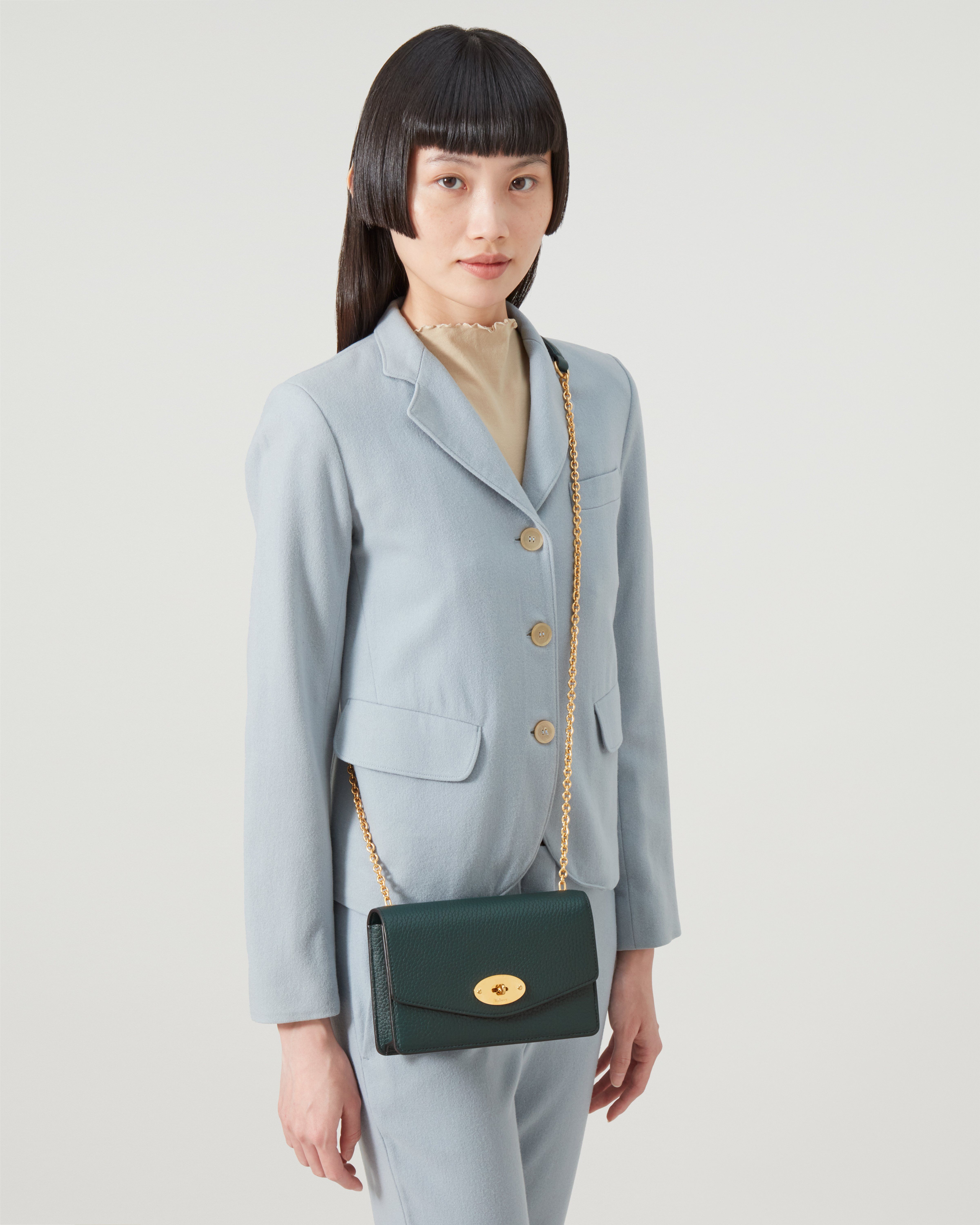 Model wearing Small Darley in Mulberry Green Heavy Grain