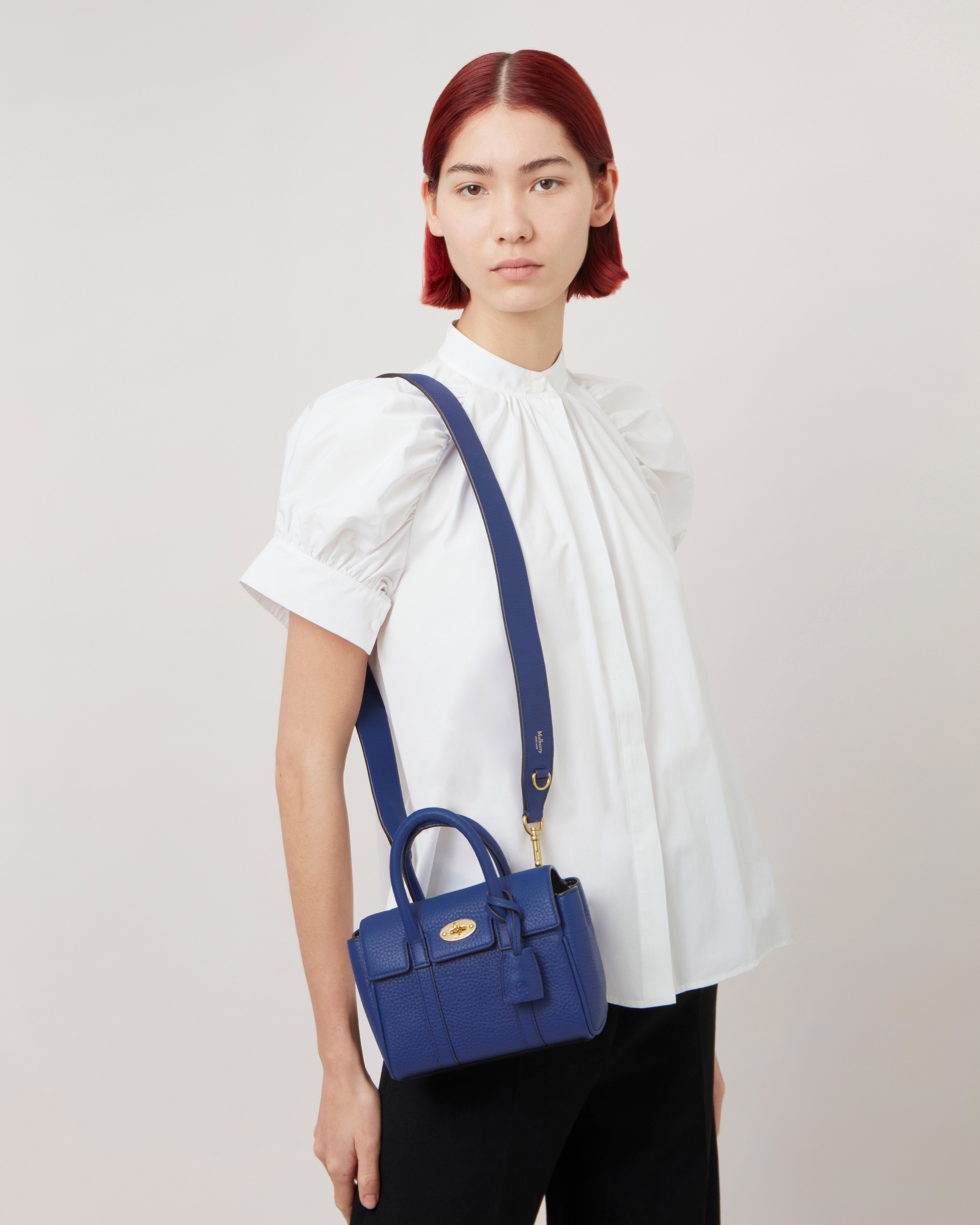 model wearing mulberry mini bayswater bag in pigment blue