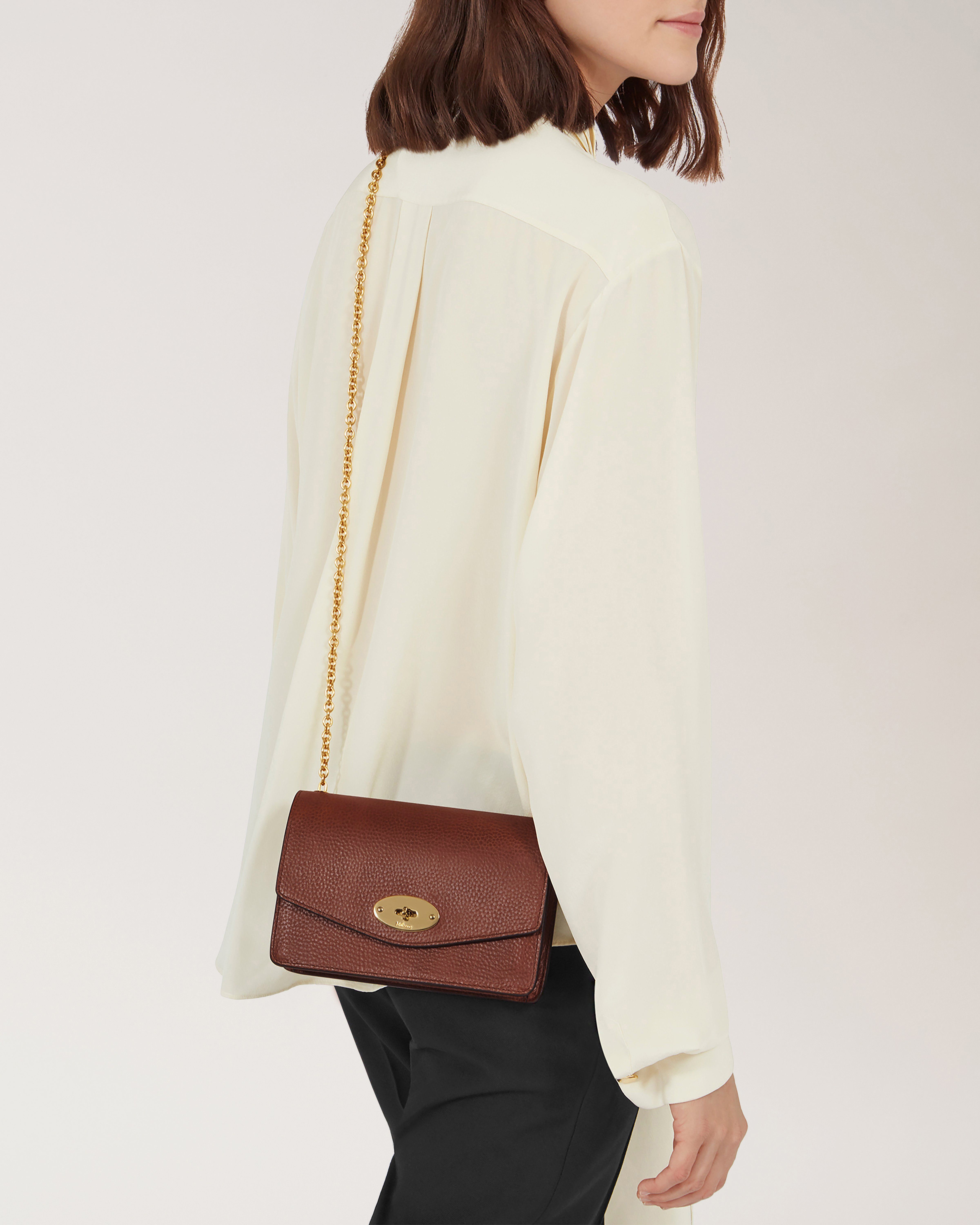Model wearing the Small Darley in Oak Small Classic Grain