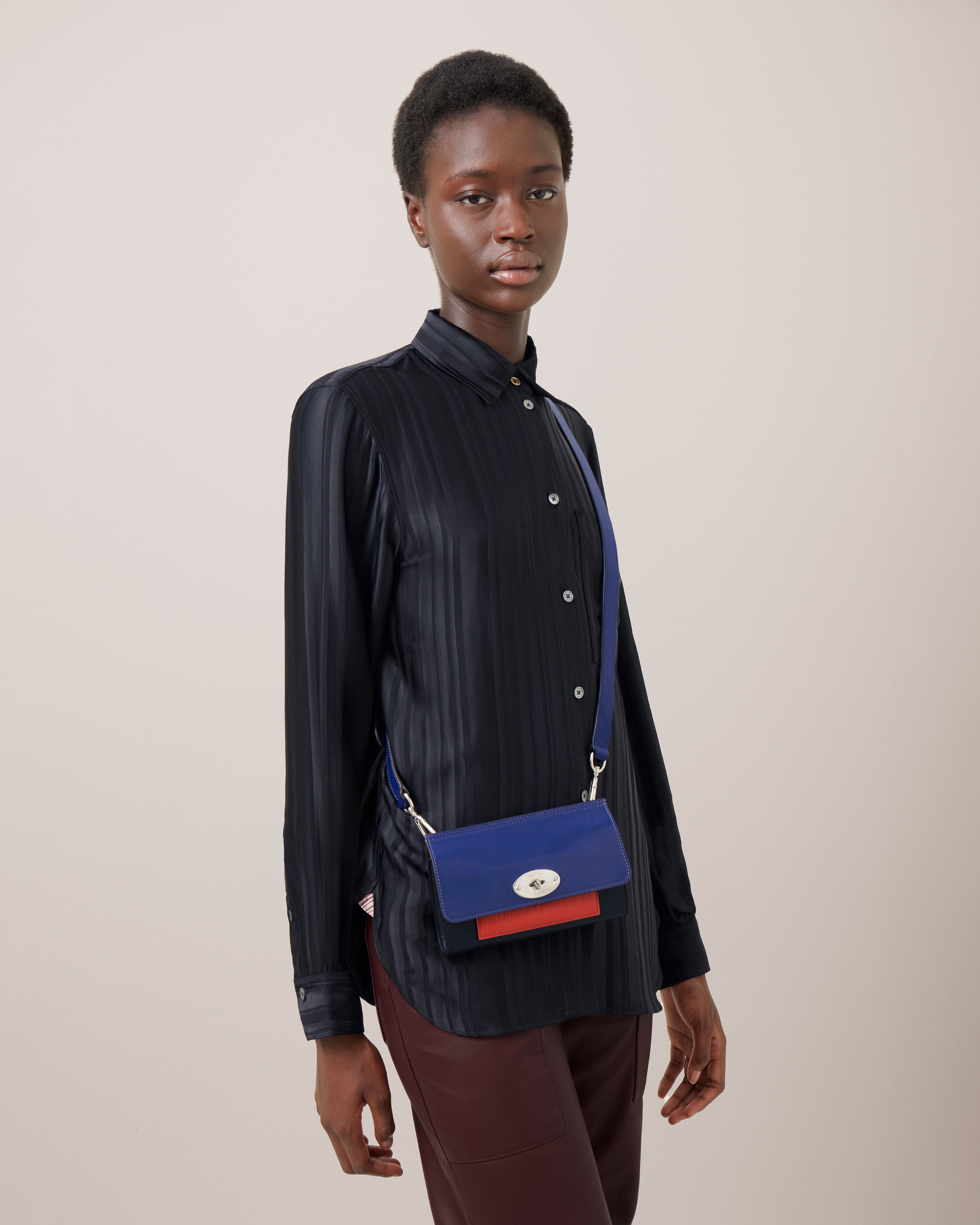 model wearing mulberry paul smith clip bag in blue